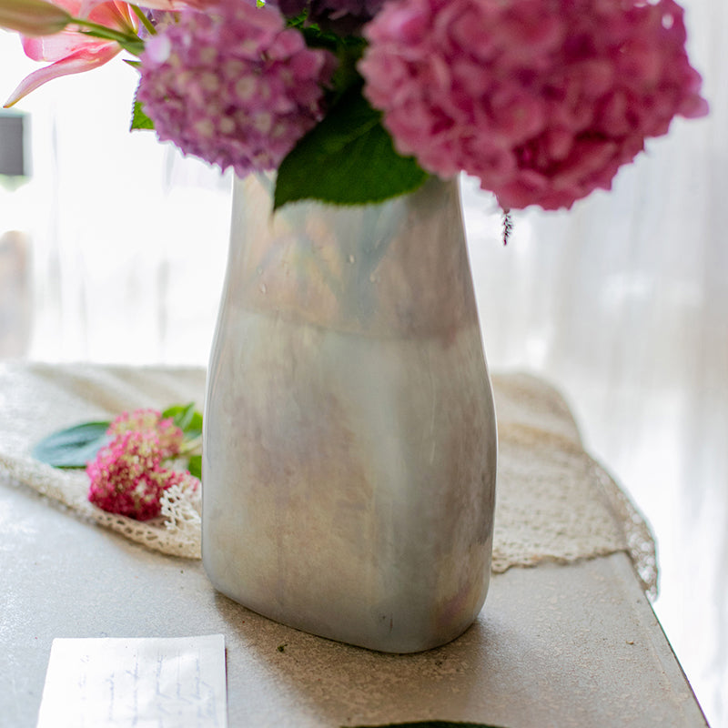 A beautifully crafted Gradient Color Art Glass Vase featuring a unique blend of pink and cream colors, showcasing its hand-blown design.