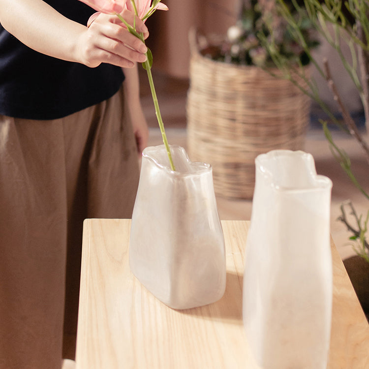 A beautifully crafted Gradient Color Art Glass Vase featuring a unique blend of pink and cream colors, showcasing its hand-blown design.