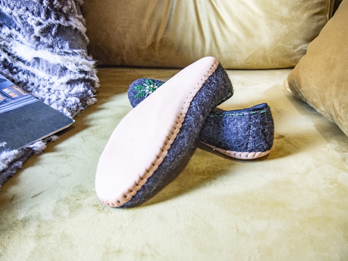 Gray felt slippers with real leather and unique handsewn beads, showcasing elegant craftsmanship.