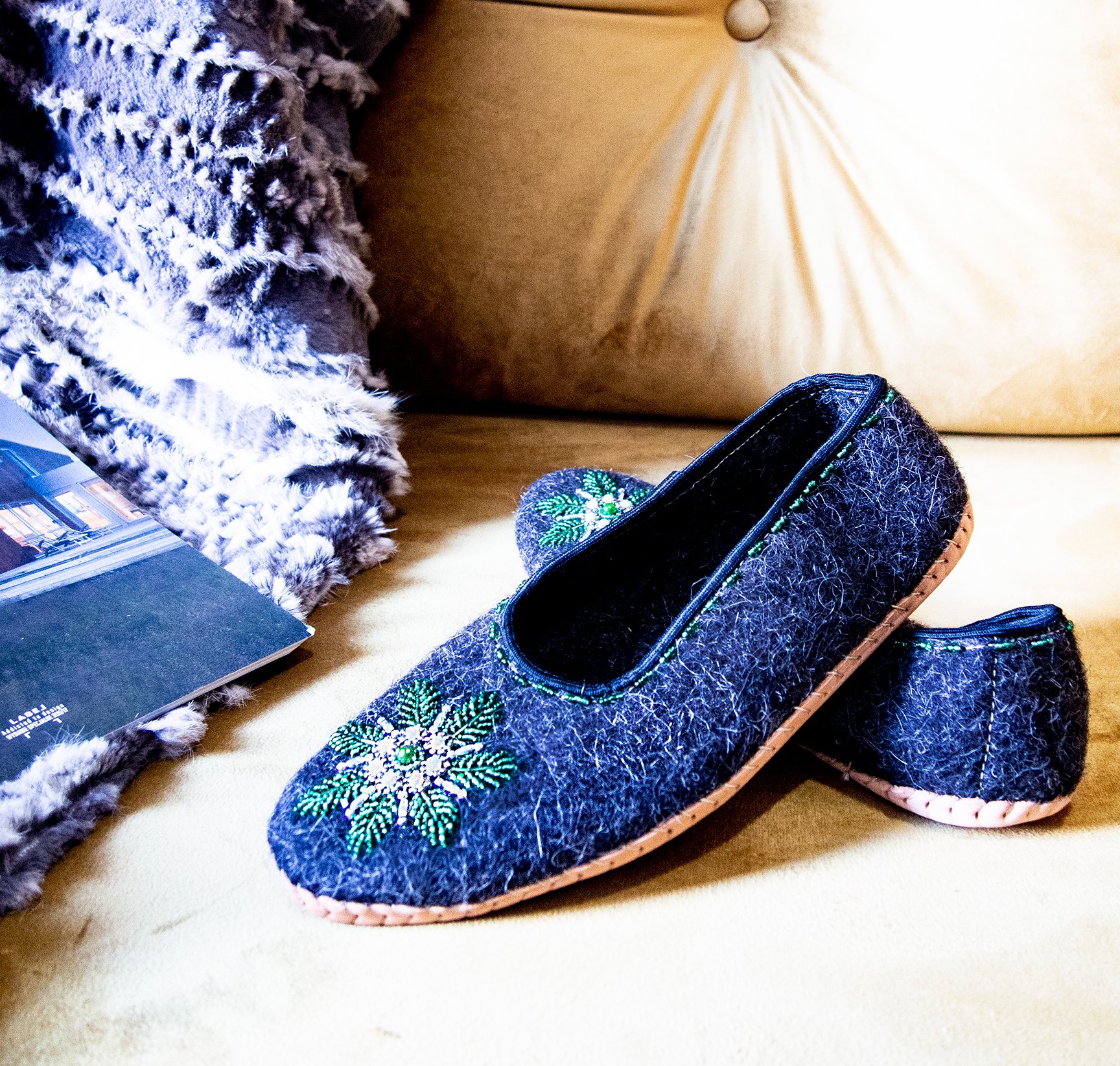 Gray felt slippers with real leather and unique handsewn beads, showcasing elegant craftsmanship.