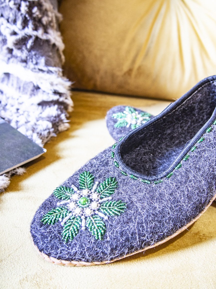 Gray felt slippers with real leather and unique handsewn beads, showcasing elegant craftsmanship.