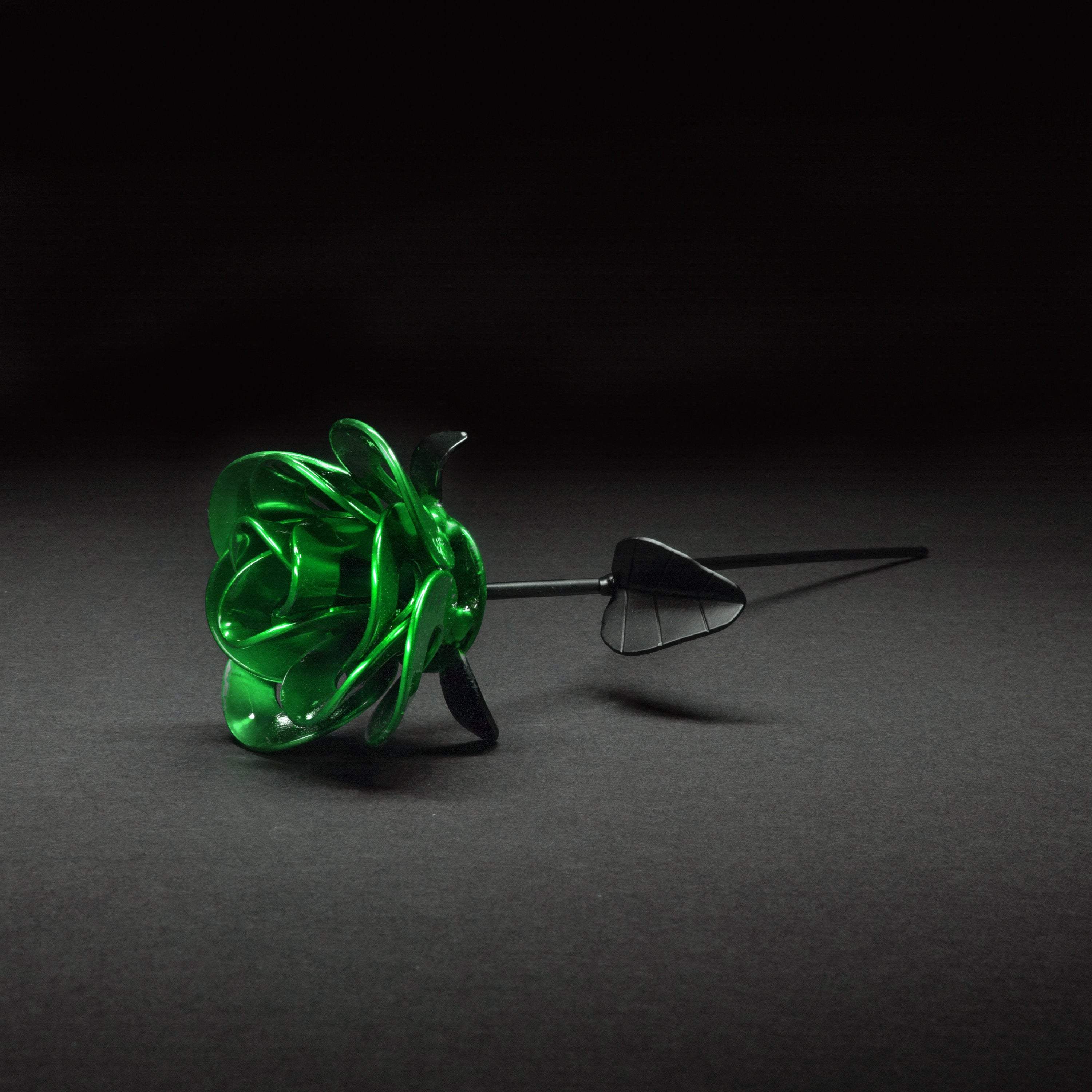 Handcrafted Green and Black Immortal Rose made from recycled metal, featuring a lustrous green head and matte black stem, elegantly packaged in a clear box.