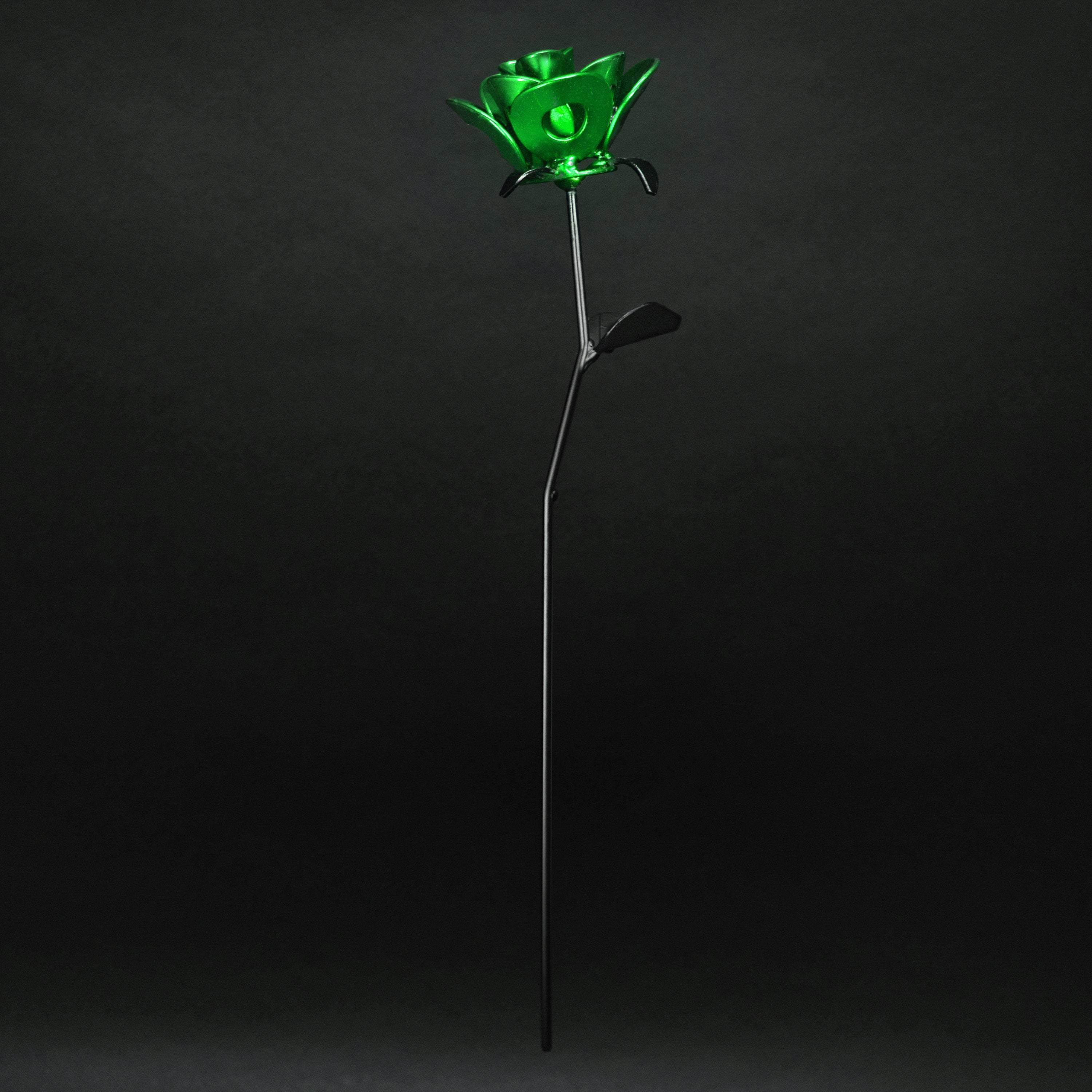 Handcrafted Green and Black Immortal Rose made from recycled metal, featuring a lustrous green head and matte black stem, elegantly packaged in a clear box.