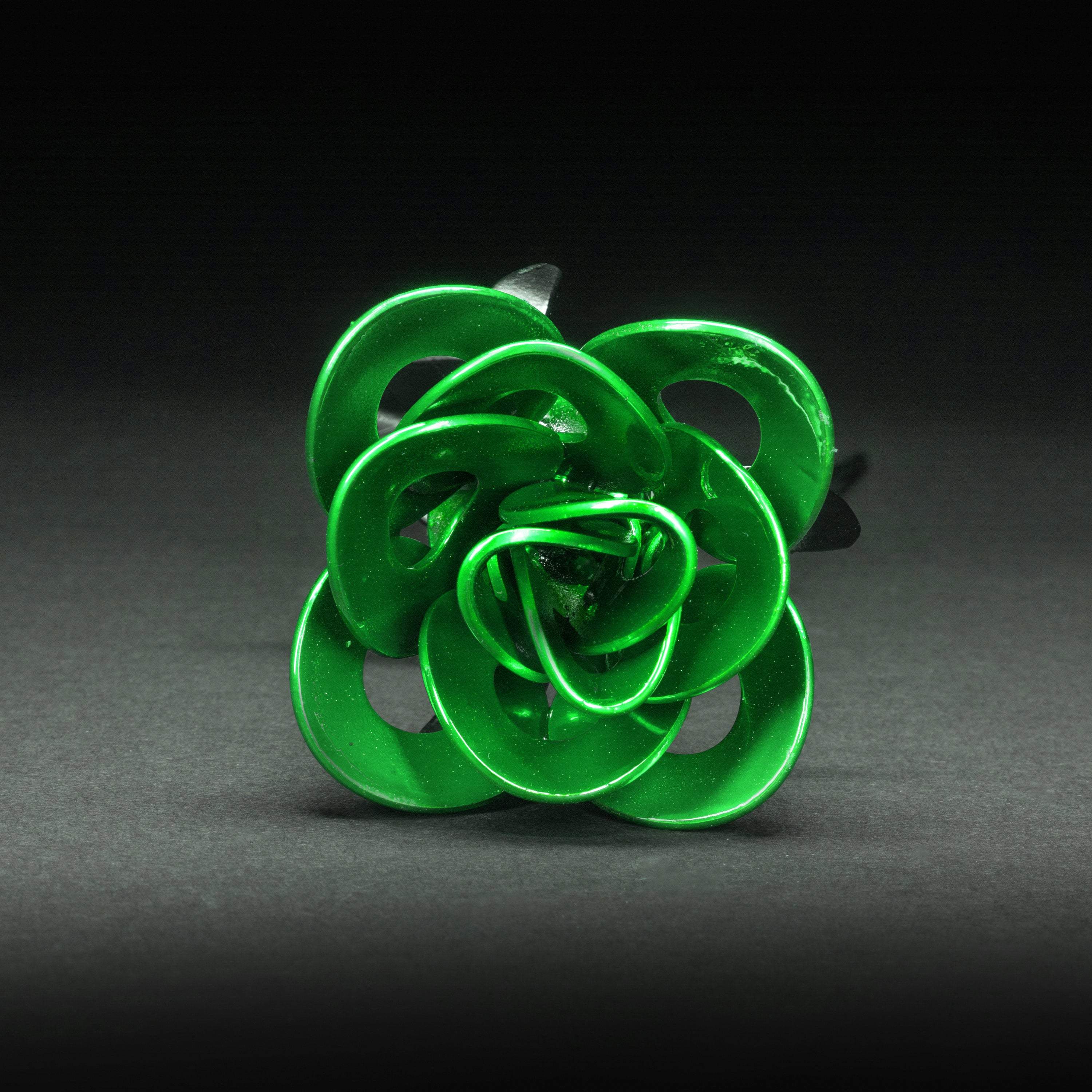 Handcrafted Green and Black Immortal Rose made from recycled metal, featuring a lustrous green head and matte black stem, elegantly packaged in a clear box.