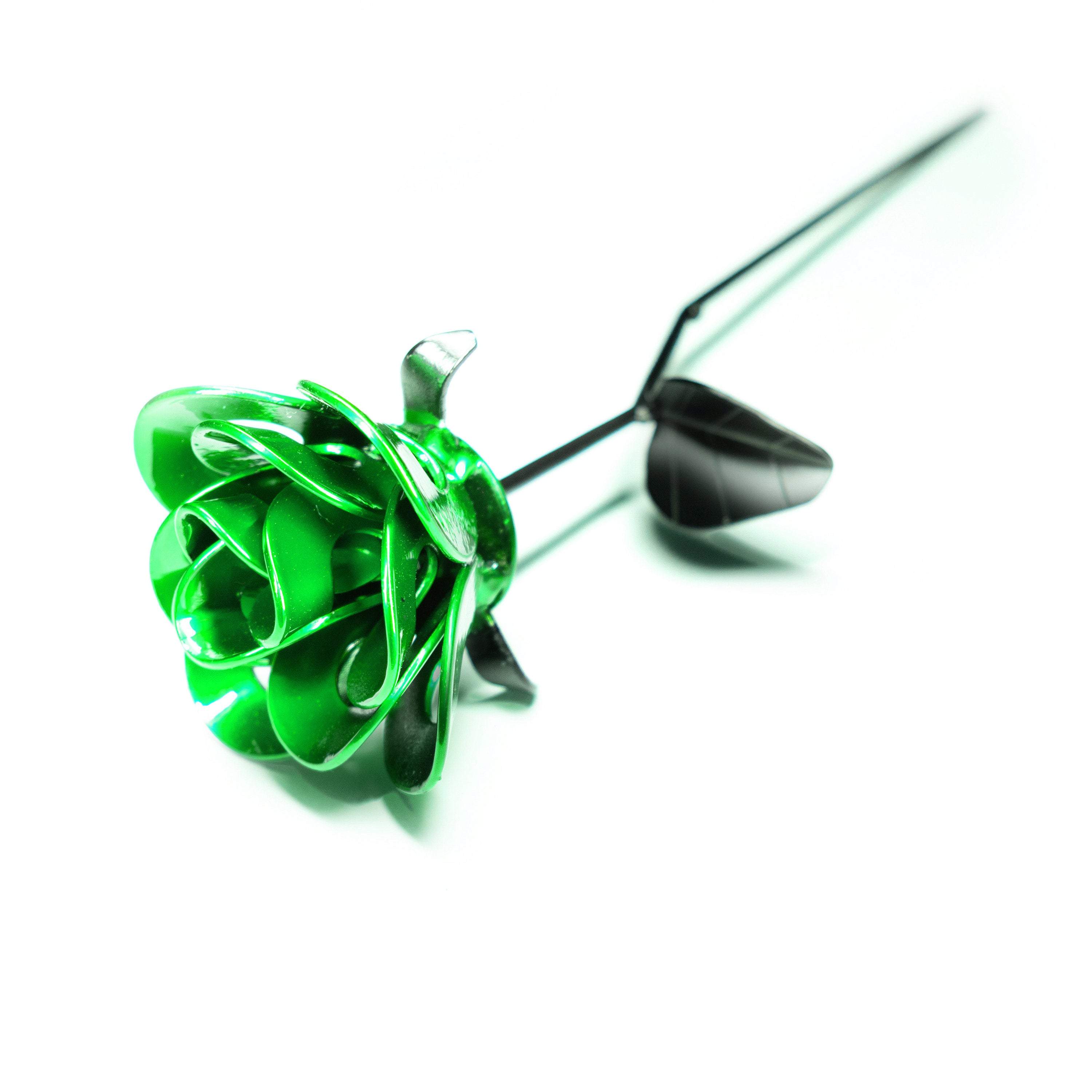 Handcrafted Green and Black Immortal Rose made from recycled metal, featuring a lustrous green head and matte black stem, elegantly packaged in a clear box.