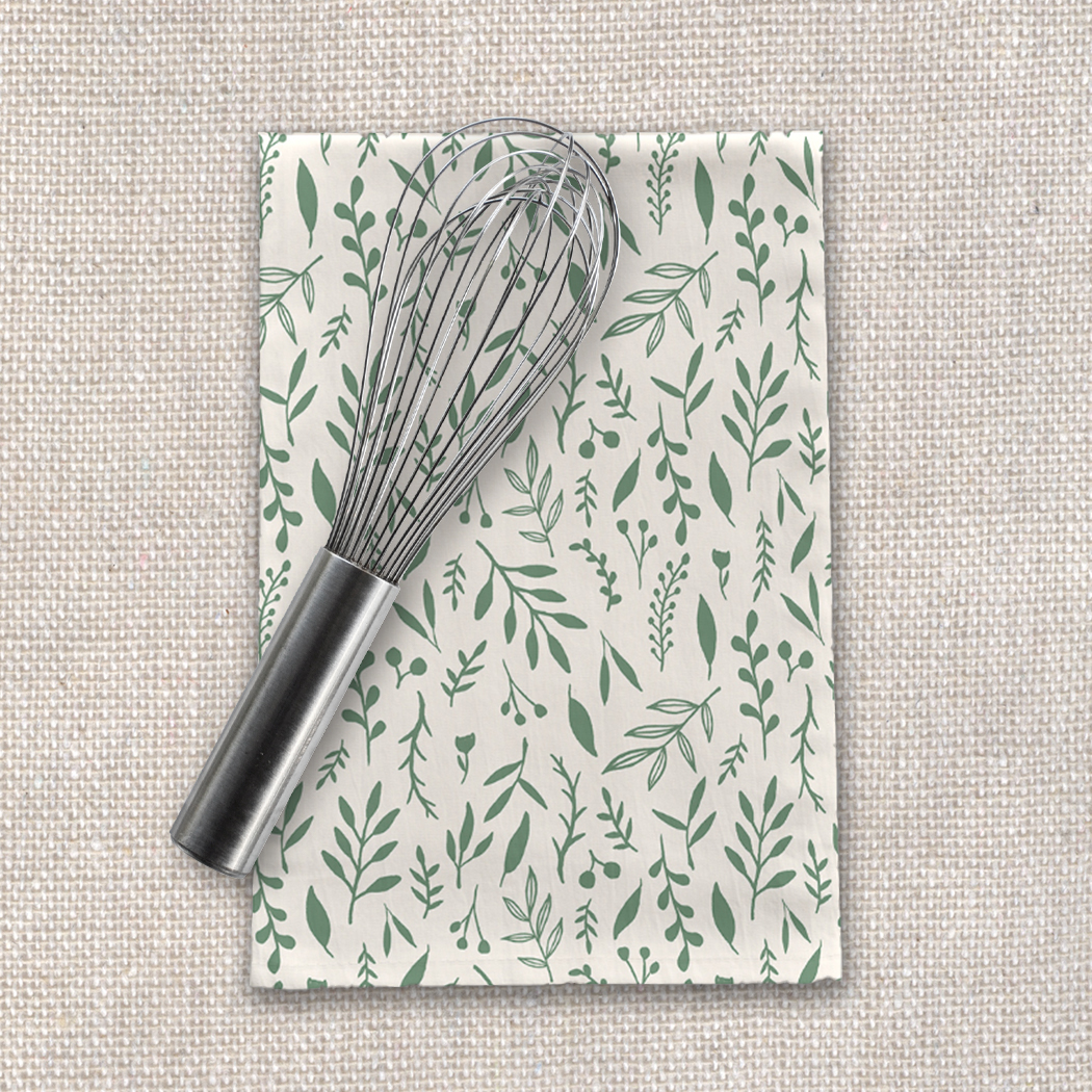 Green Falling Leaves Tea Towel made of cotton twill, featuring a vibrant leaf design, perfect for kitchen decor.