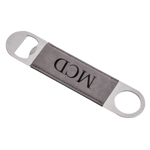 Grey leatherette and stainless steel bottle opener, measuring 7 inches by 1.5 inches, elegantly designed for easy beverage opening.