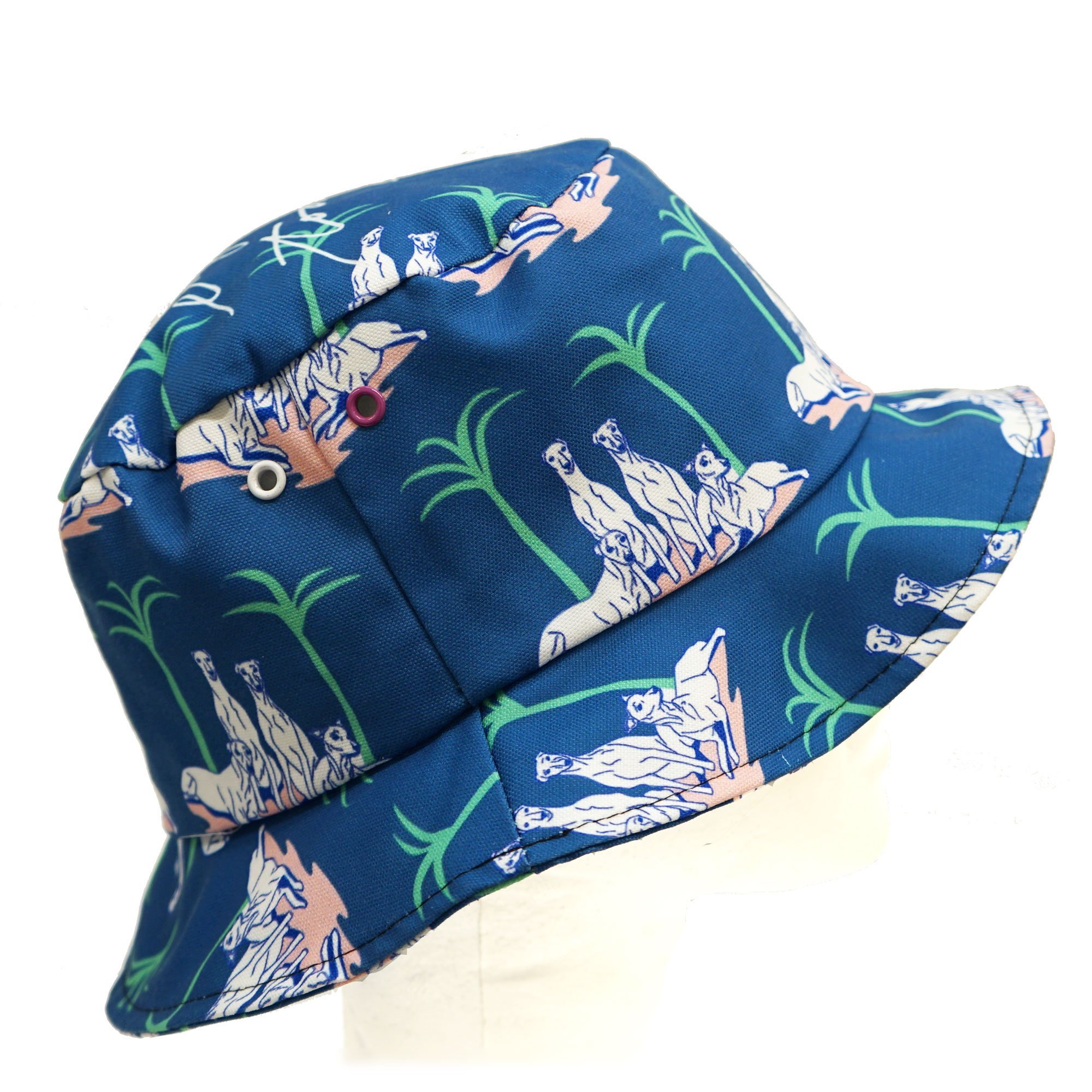 A stylish greyhound and palm tree bucket hat made from cotton canvas, perfect for summer outings.