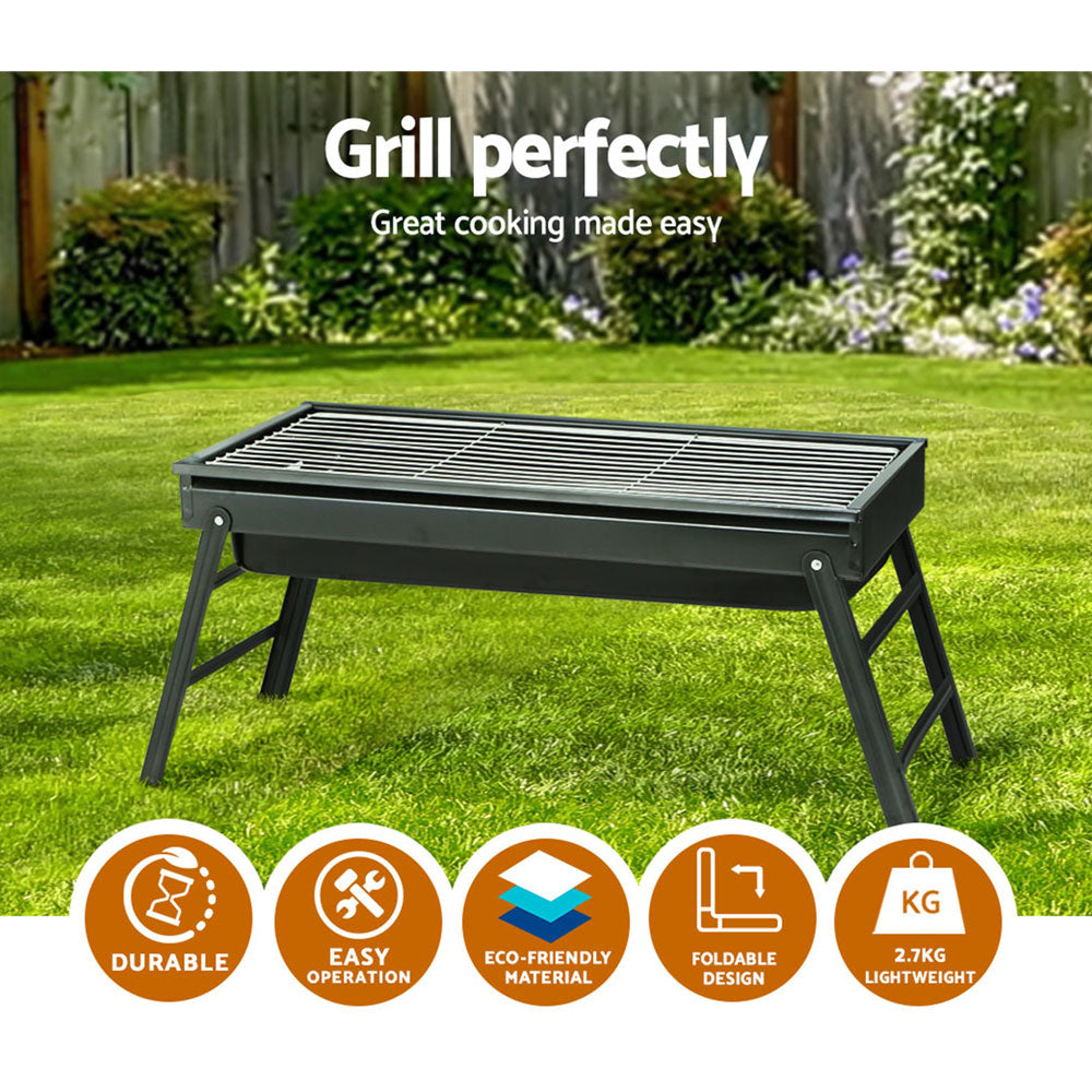 Grillz Charcoal BBQ Grill Smoker with foldable legs and stainless steel grill top, perfect for outdoor cooking.