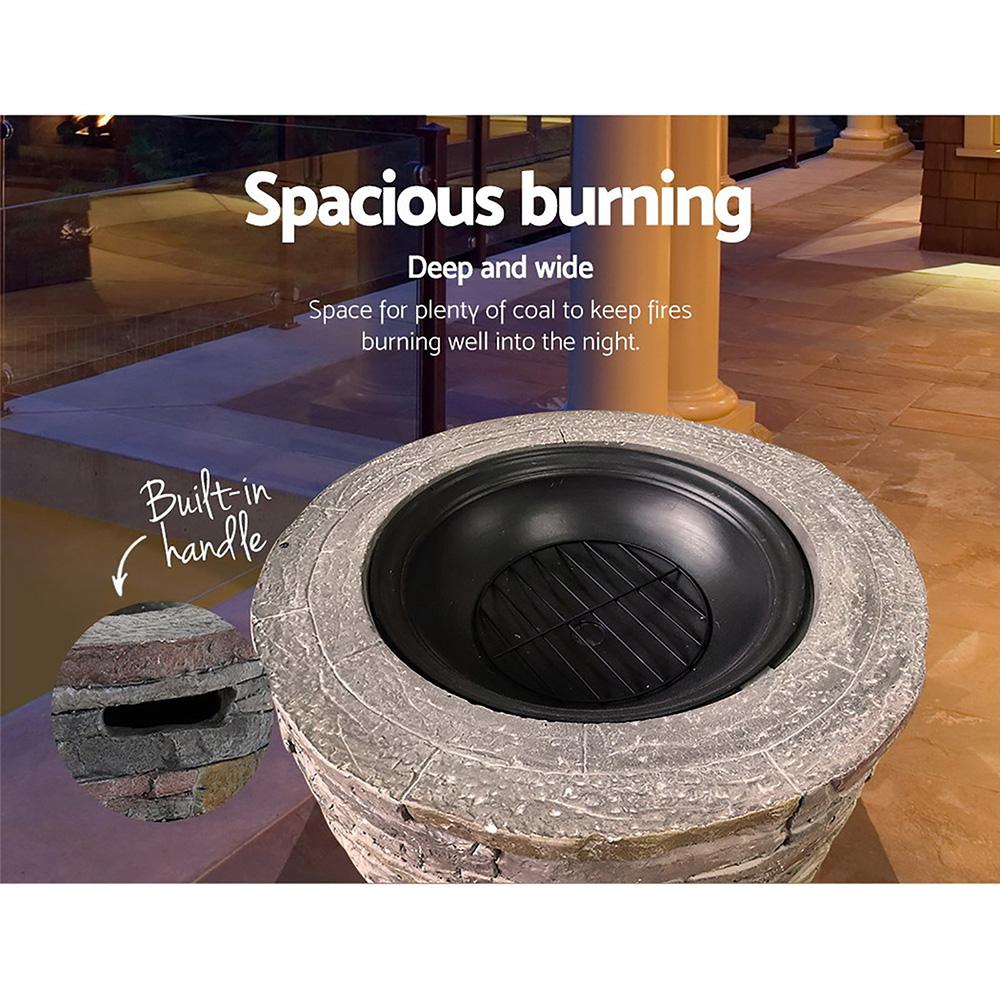 Grillz Fire Pit Outdoor Table featuring faux stone design with a spacious burning area and safety mesh dome.