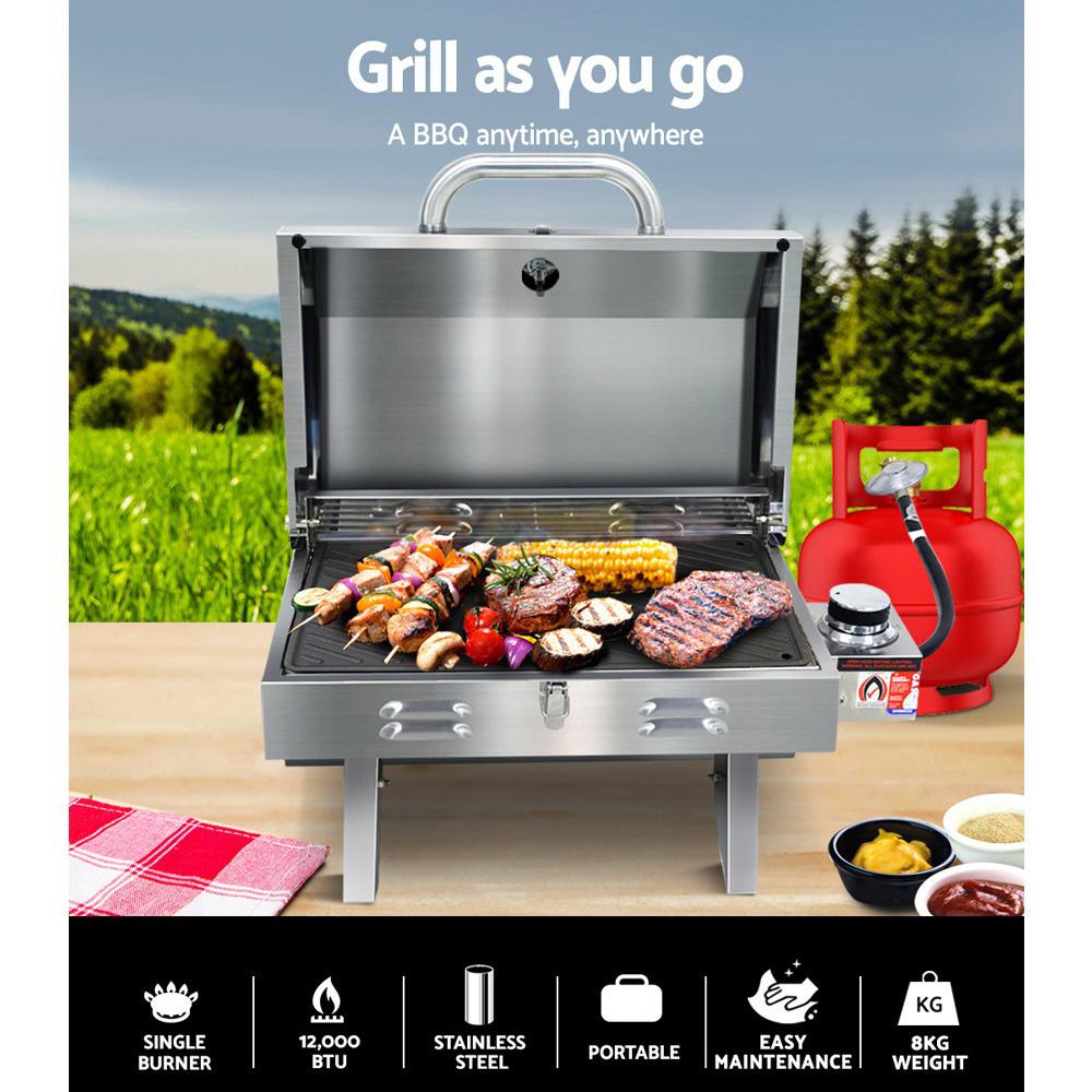 Grillz Portable Gas BBQ with foldable legs and stainless steel finish, showcasing its double-sided grill plate and integrated thermometer.