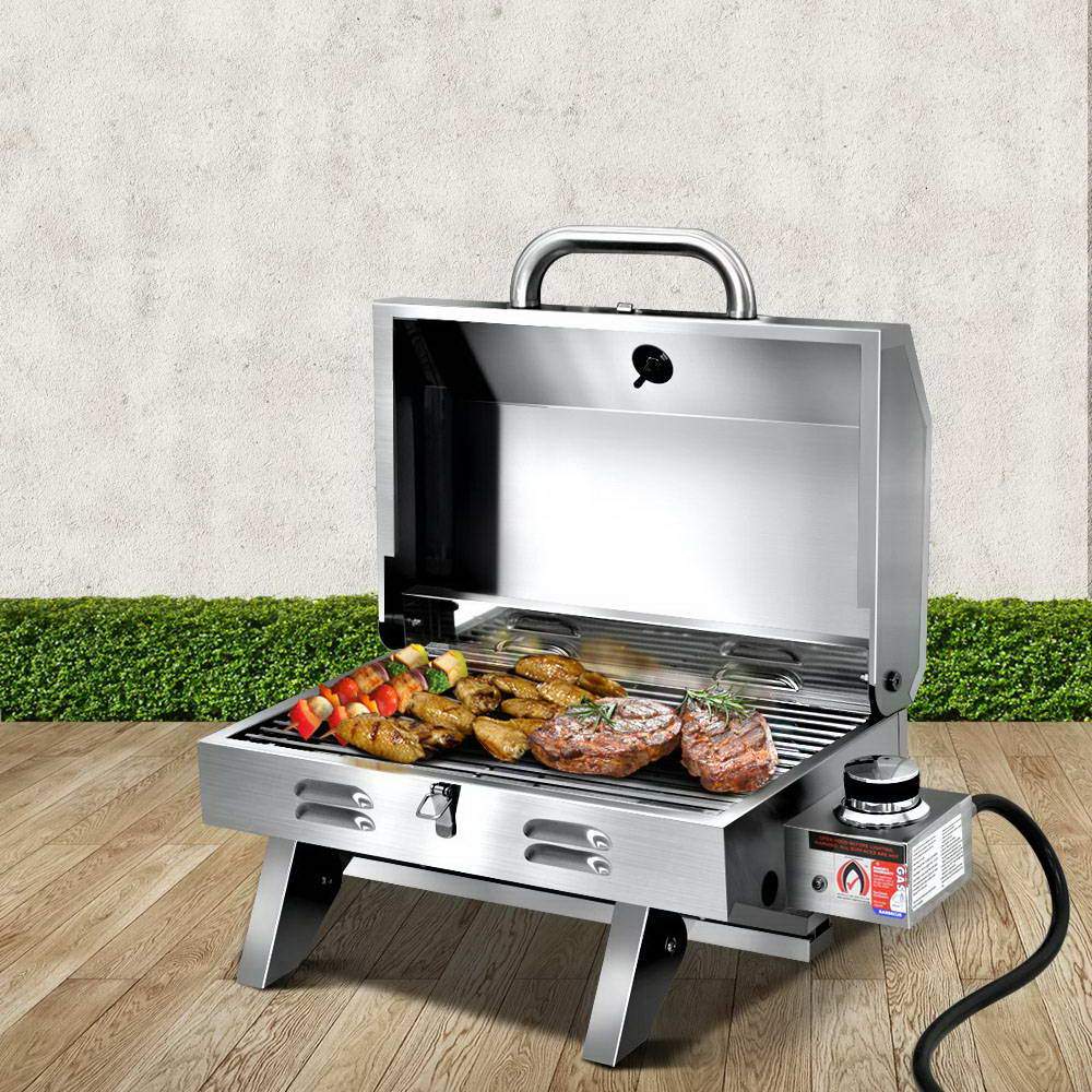 Grillz Portable Gas BBQ Grill Heater with stainless steel finish, foldable legs, and integrated thermometer, perfect for outdoor cooking.