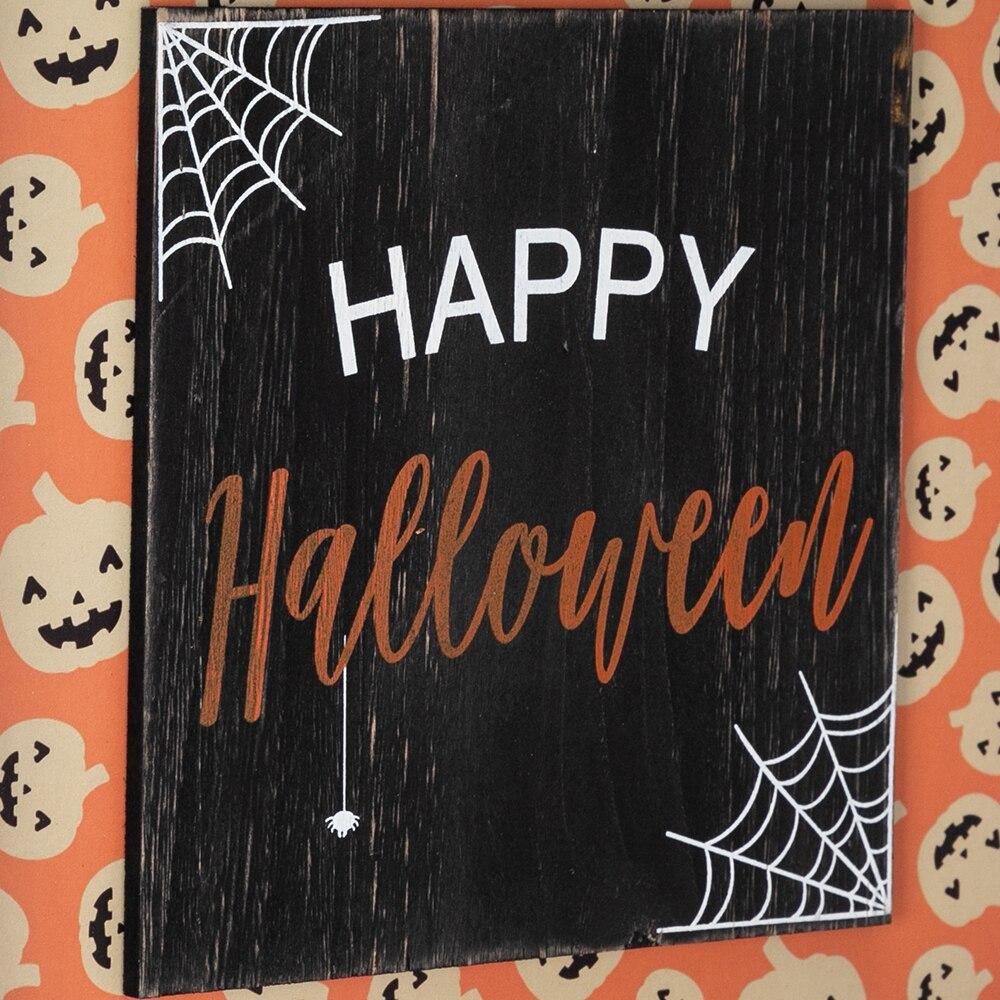 A cheerful Halloween wood wall sign featuring a happy pumpkin design with an orange bottom, perfect for festive decorations.