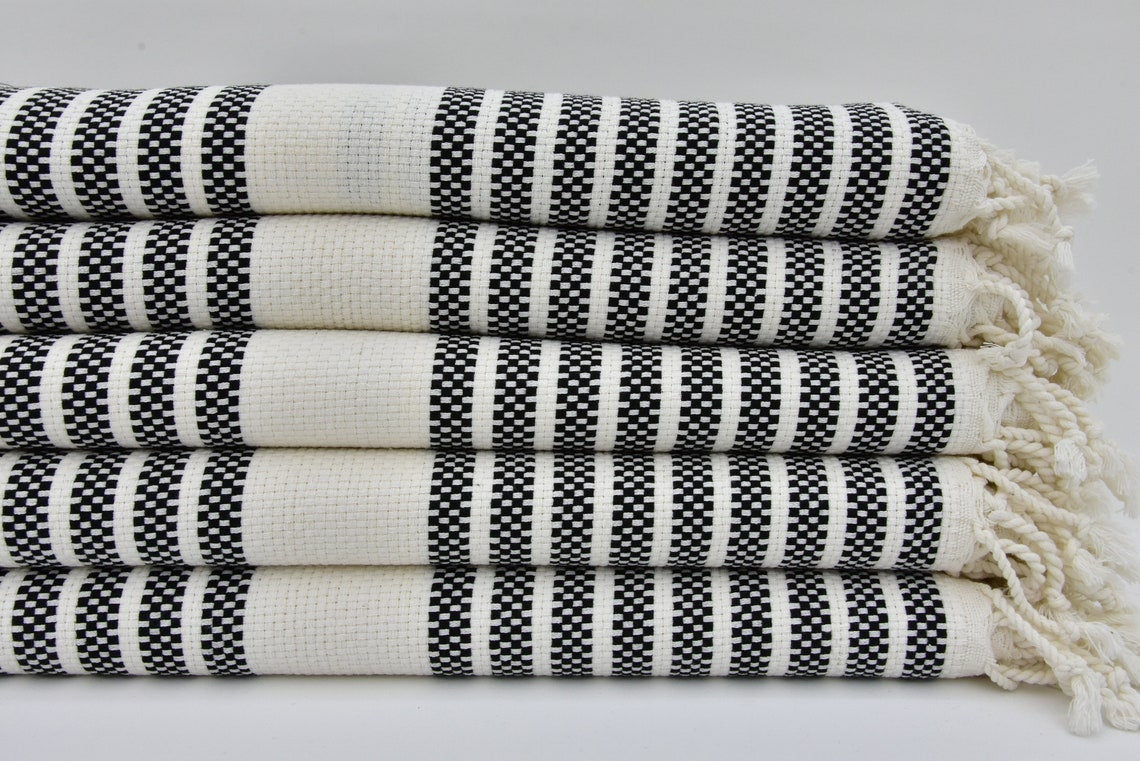 A beautifully designed Hammam towel made from 100% Turkish cotton, featuring a classic herringbone pattern, perfect for beach, yoga, and home use.