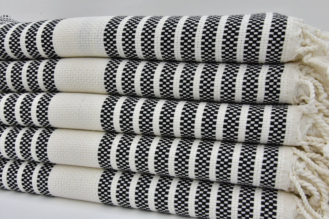 A beautifully designed Hammam towel made from 100% Turkish cotton, featuring a classic herringbone pattern, perfect for beach, yoga, and home use.