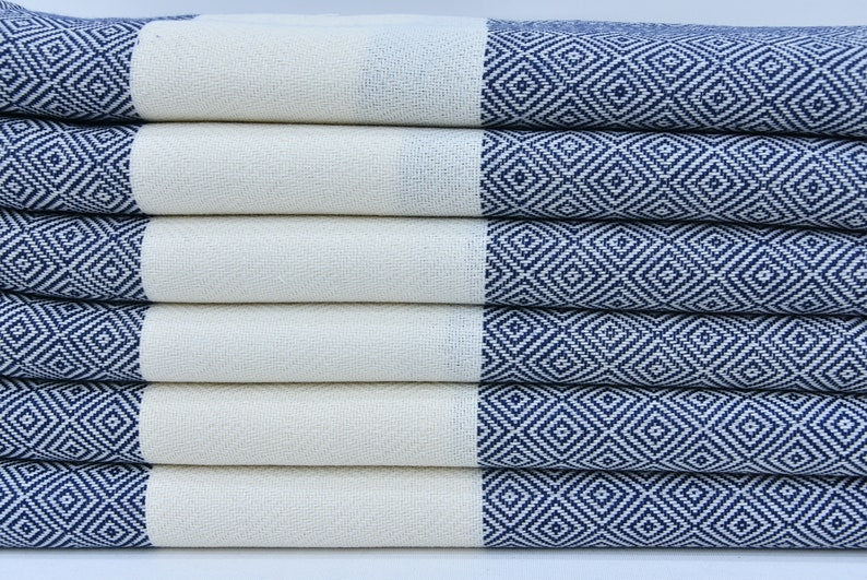 A beautifully designed Hammam towel made from 100% Turkish cotton, featuring a classic herringbone pattern, perfect for beach, yoga, and home use.