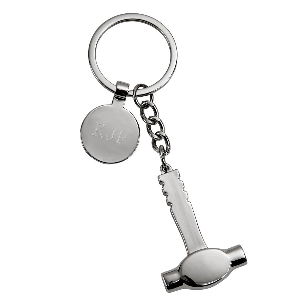 A polished nickel-plated hammer keychain with an engraving tag, presented in a black gift box.