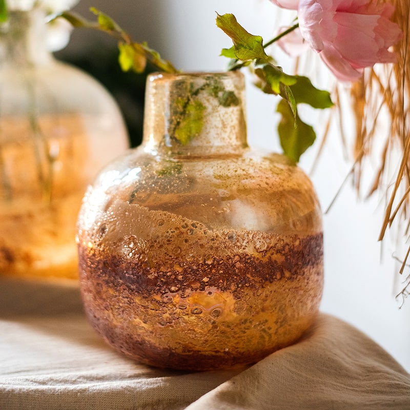 Hand Blown Bubble Glass Bud Vase in Amber, showcasing a textured finish and unique shape, perfect for floral arrangements.