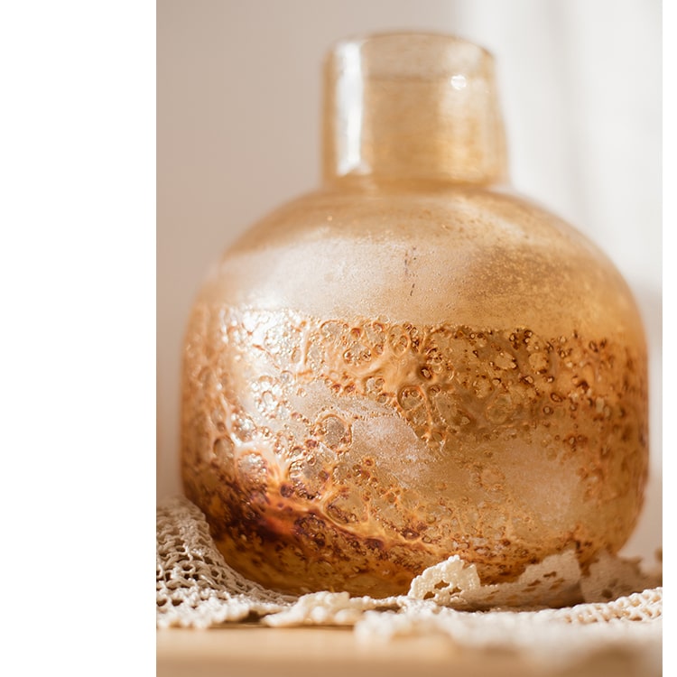 Hand Blown Bubble Glass Bud Vase in Amber, showcasing a textured finish and unique shape, perfect for floral arrangements.