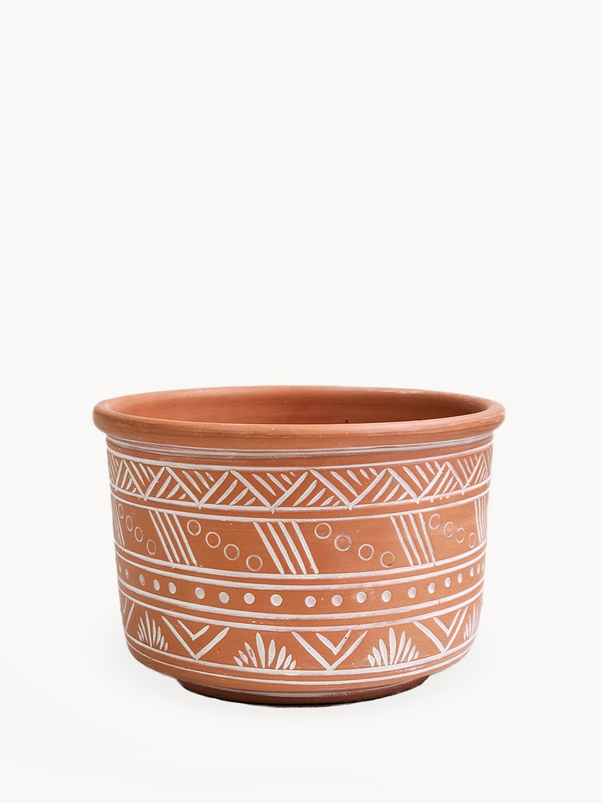 Large hand-etched terracotta pot showcasing intricate designs, perfect for indoor and outdoor plants.