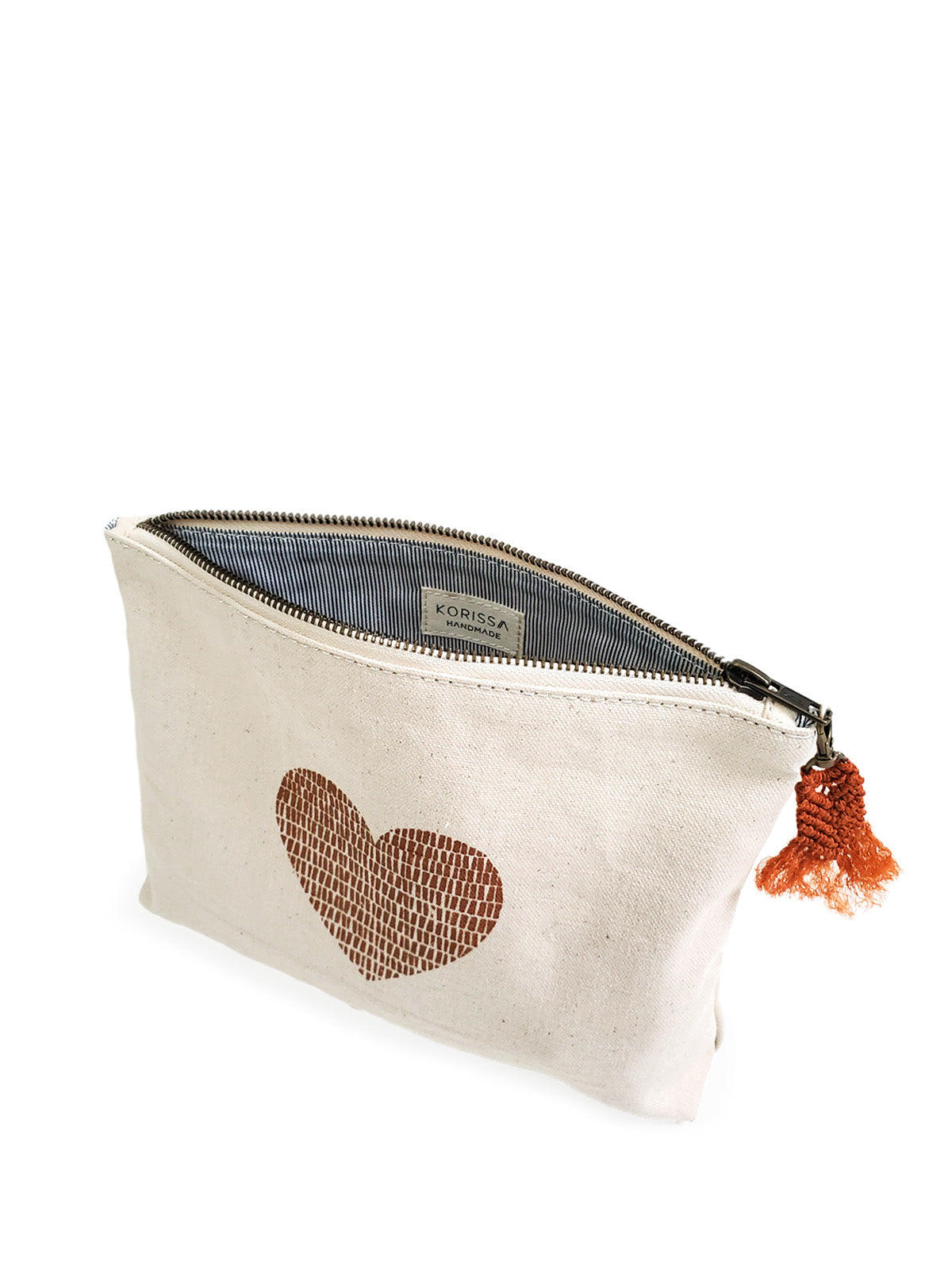 Hand screen printed cotton canvas pouch with hemp tassel, featuring a cinnamon color print on natural cream fabric.