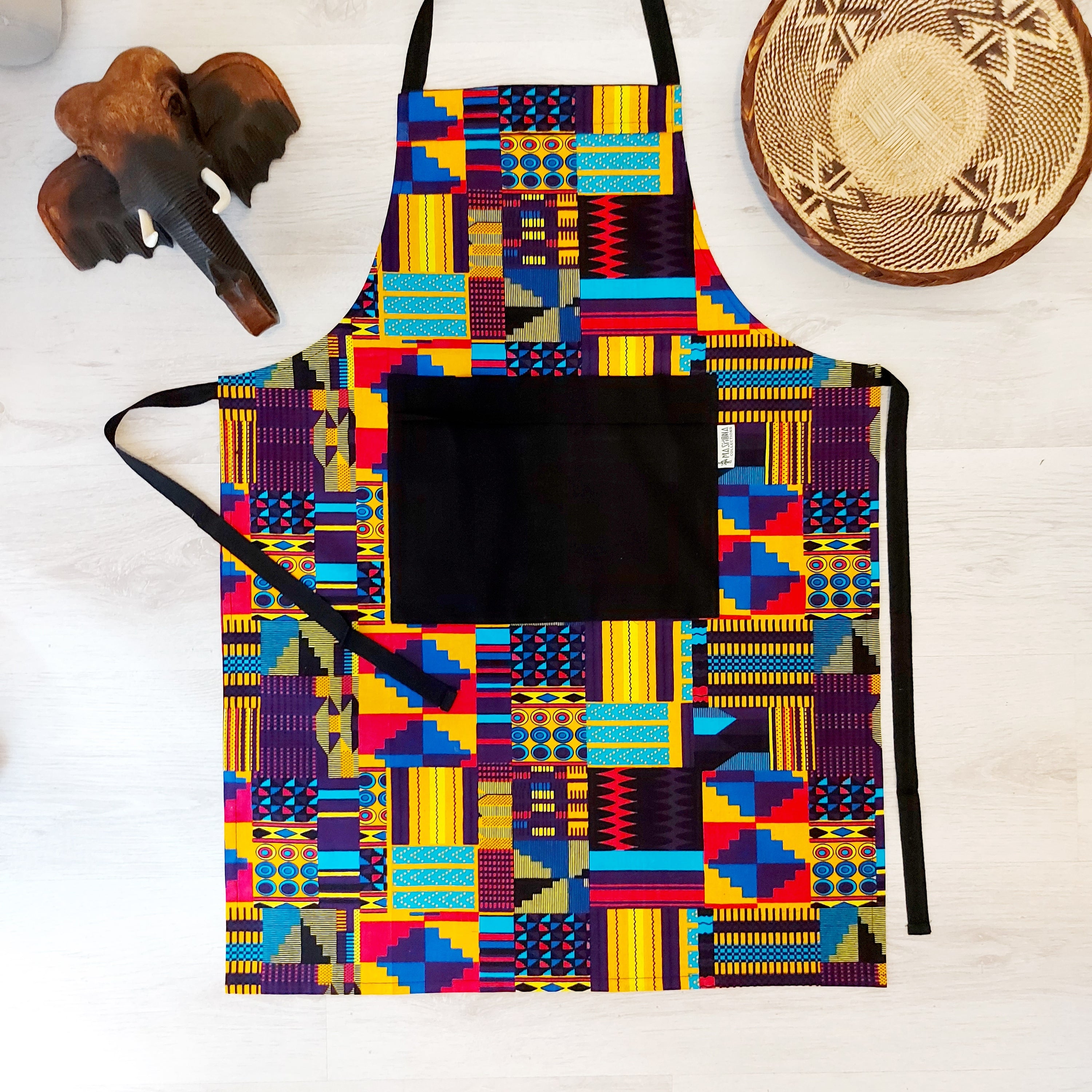 Handmade African Print Apron featuring vibrant Bogolan patterns, crafted from 100% cotton fabric with a convenient pocket.