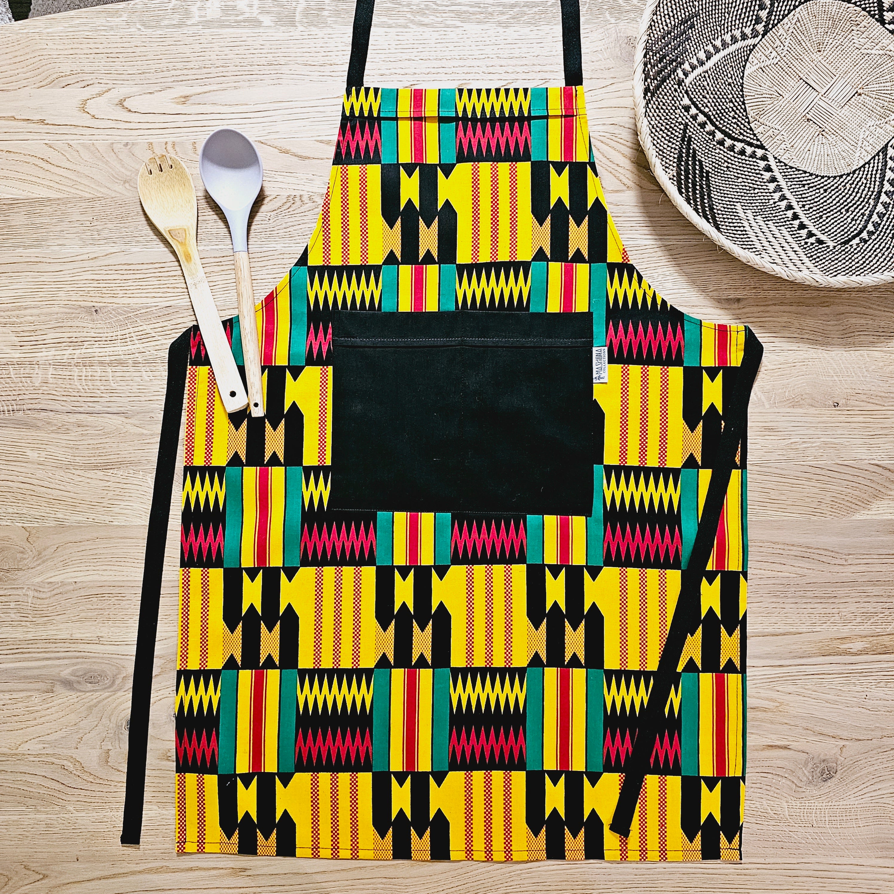 Handmade African Print Apron with matching oven gloves, showcasing vibrant colors and deep pockets, crafted from 100% cotton.