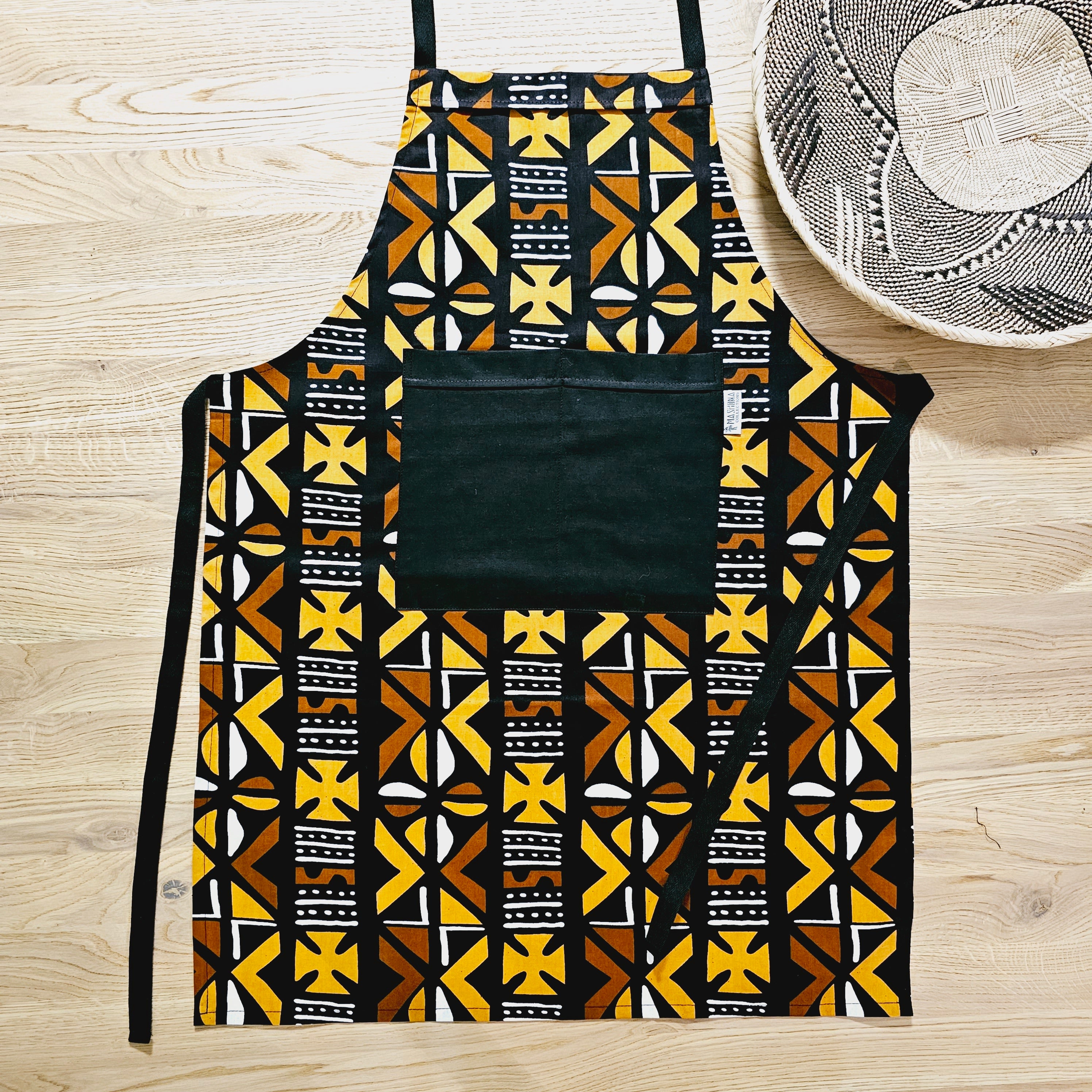 Handmade African Print Apron with matching oven gloves, showcasing vibrant colors and deep pockets, crafted from durable 100% cotton fabric.