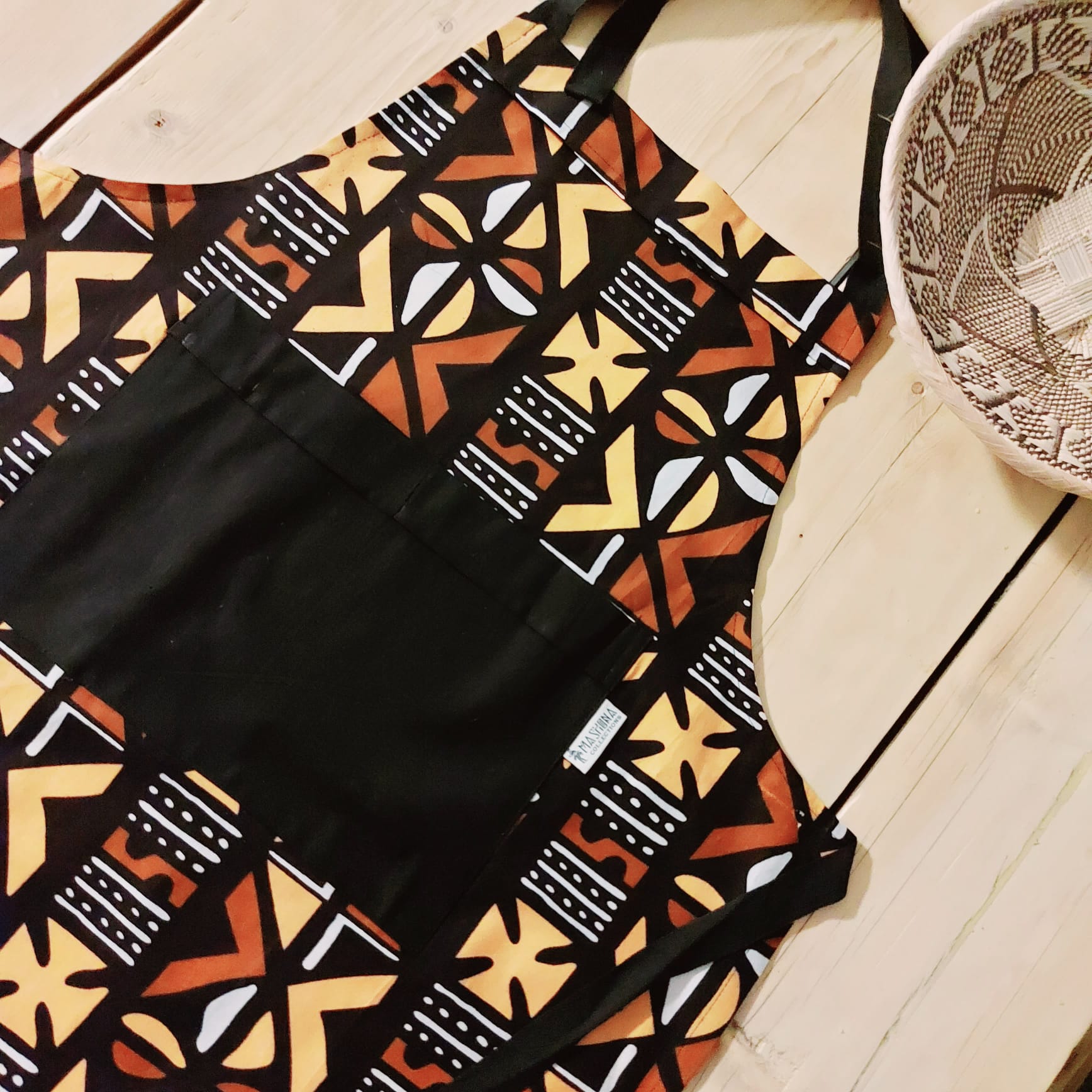 Handmade apron and matching oven gloves set featuring vibrant African print designs, crafted from 100% cotton fabric.