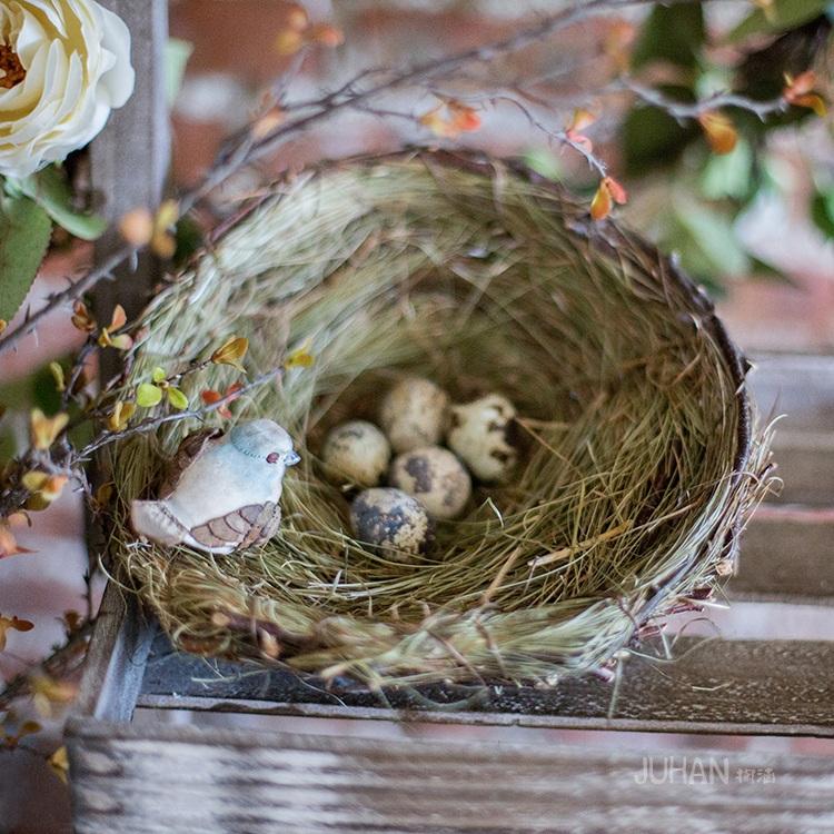 Set of 3 handmade bird's nest ornaments made from grass and willow, showcasing natural colors of brown and green.