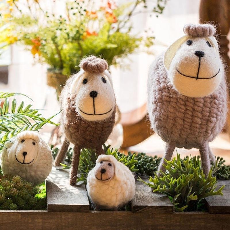 A charming set of three handmade wool sheep knick-knacks in various colors, perfect for home decor.