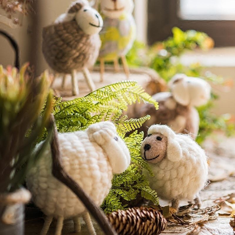 A charming set of three handmade wool sheep knick-knacks in various colors, perfect for home decor.