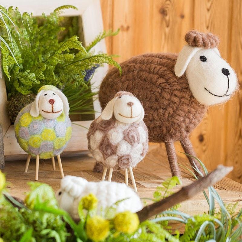 A charming set of three handmade wool sheep knick-knacks in various colors, perfect for home decor.