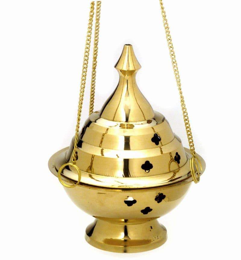 A beautifully crafted 6-inch hanging brass incense burner with clover-shaped holes, showcasing its polished finish and compact design.