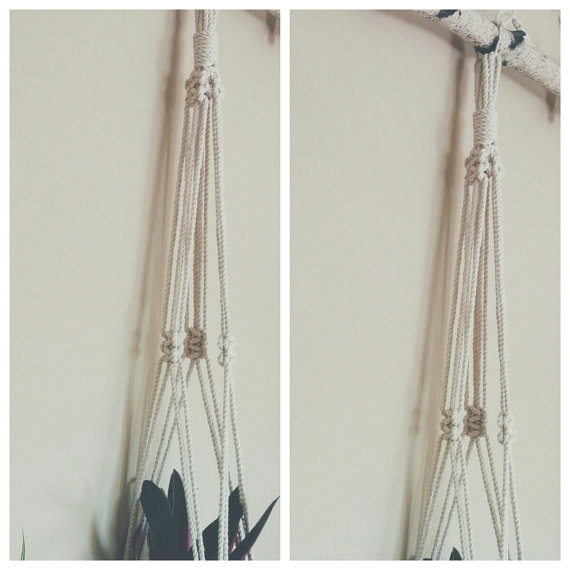 A beautifully crafted macrame plant hanger made from 100% natural cotton rope, showcasing a stylish design with tassels, perfect for indoor plants.