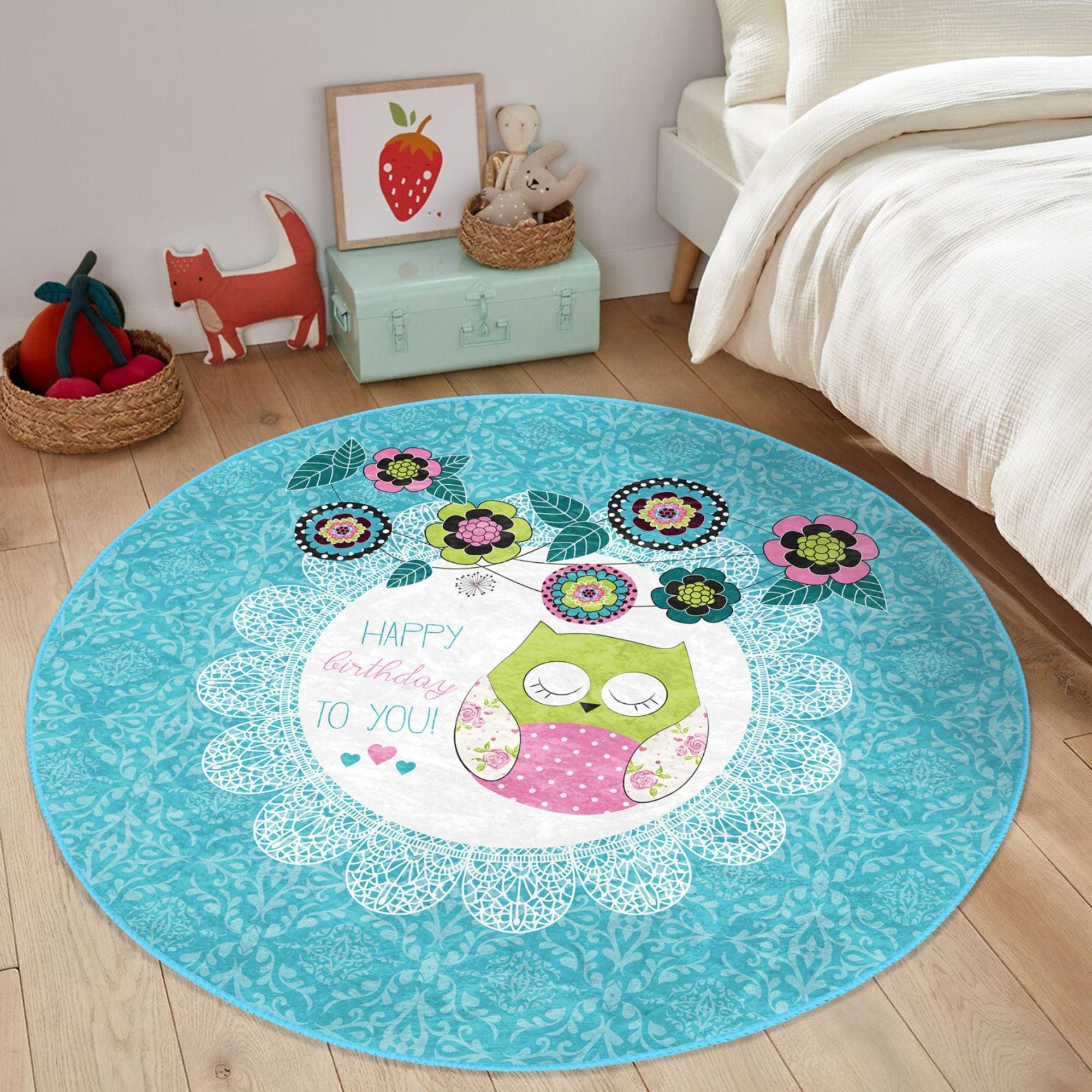 A colorful round rug featuring a happy birthday owl pattern, perfect for kids' rooms, showcasing vibrant colors and soft velvet texture.