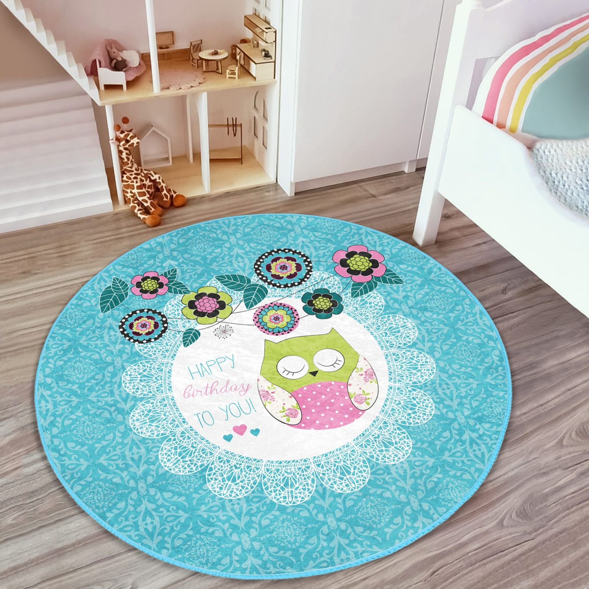 A colorful round rug featuring a happy birthday owl pattern, perfect for kids' rooms, showcasing vibrant colors and soft velvet texture.