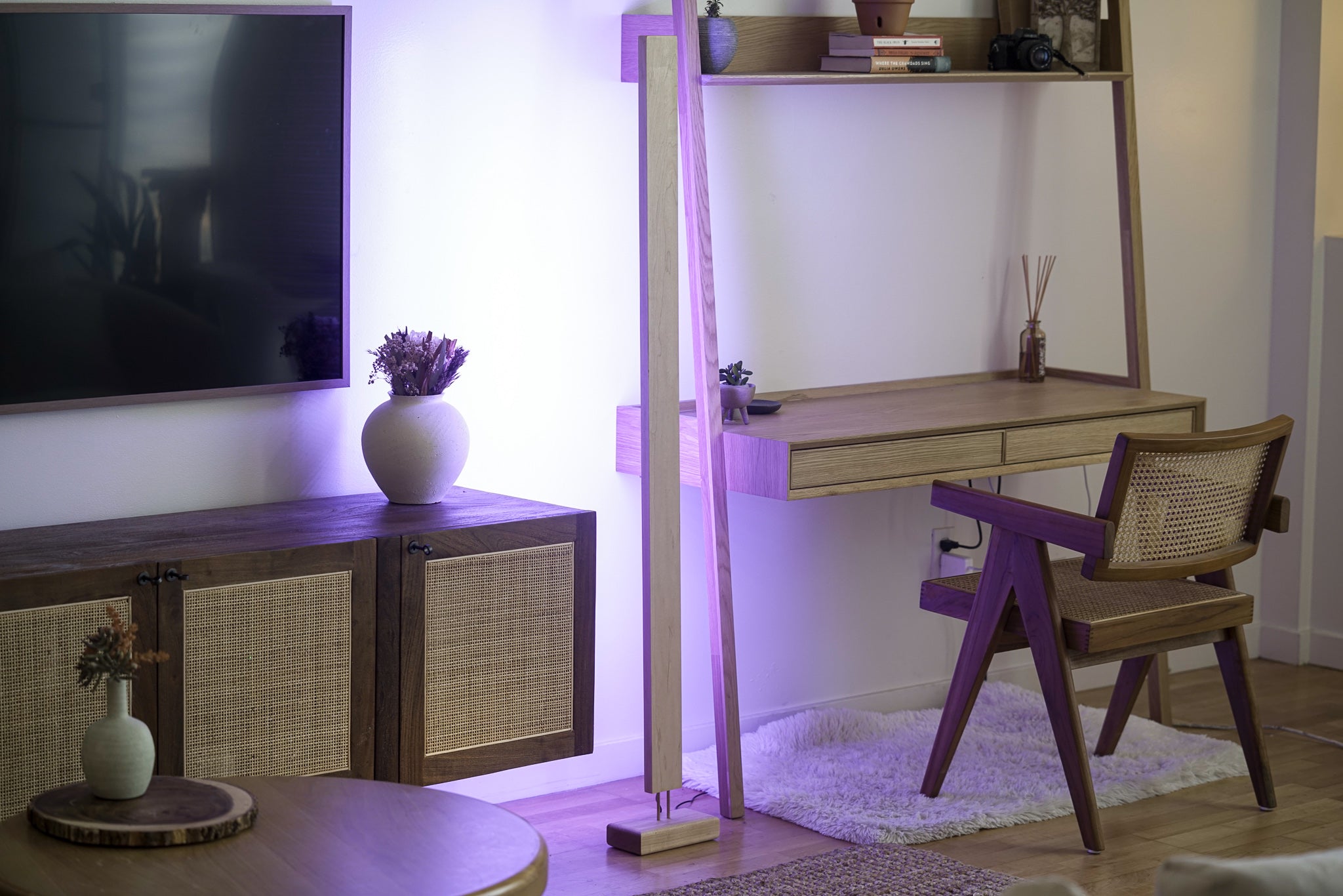 A sleek Hardwood LED Color Floor Lamp made from sustainably sourced Black Walnut and White Maple, featuring a slim design and colorful RGB lighting.