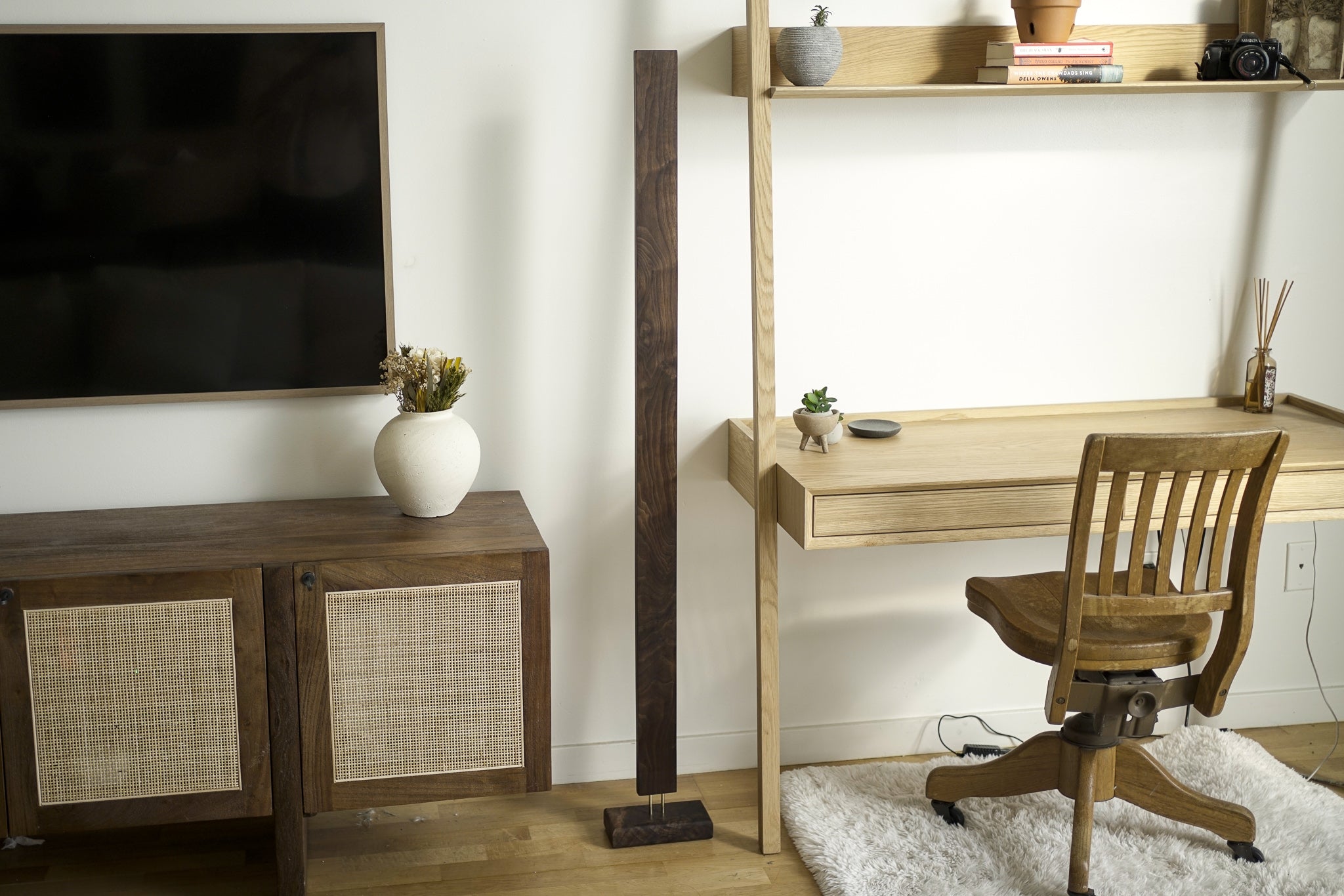 A sleek Hardwood LED Color Floor Lamp made from sustainably sourced Black Walnut and White Maple, featuring a slim design and colorful RGB lighting.