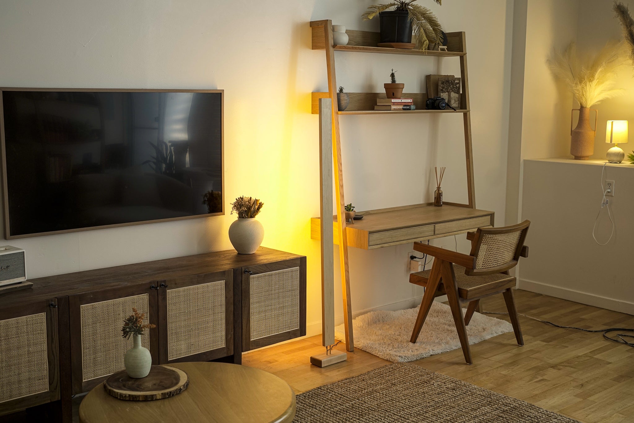 A sleek Hardwood LED Color Floor Lamp made from sustainably sourced Black Walnut and White Maple, featuring a slim design and colorful RGB lighting.