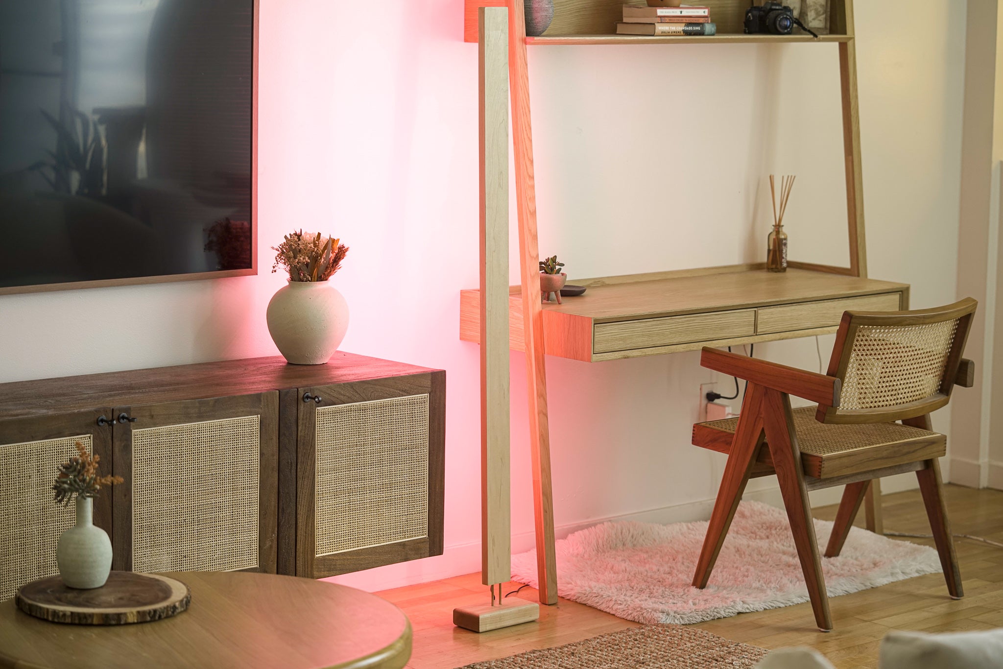 A sleek Hardwood LED Color Floor Lamp made from sustainably sourced Black Walnut and White Maple, featuring a slim design and colorful RGB lighting.