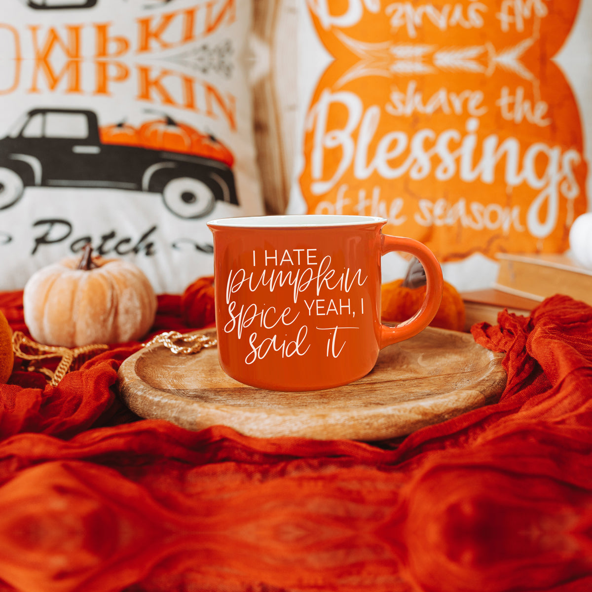 Hate Pumpkin Mug in vibrant orange with white lettering, featuring the phrase 'I hate pumpkin spice, yeah I said it' on both sides.