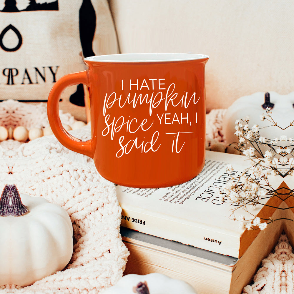 Hate Pumpkin Mug in vibrant orange with white lettering, featuring the phrase 'I hate pumpkin spice, yeah I said it' on both sides.