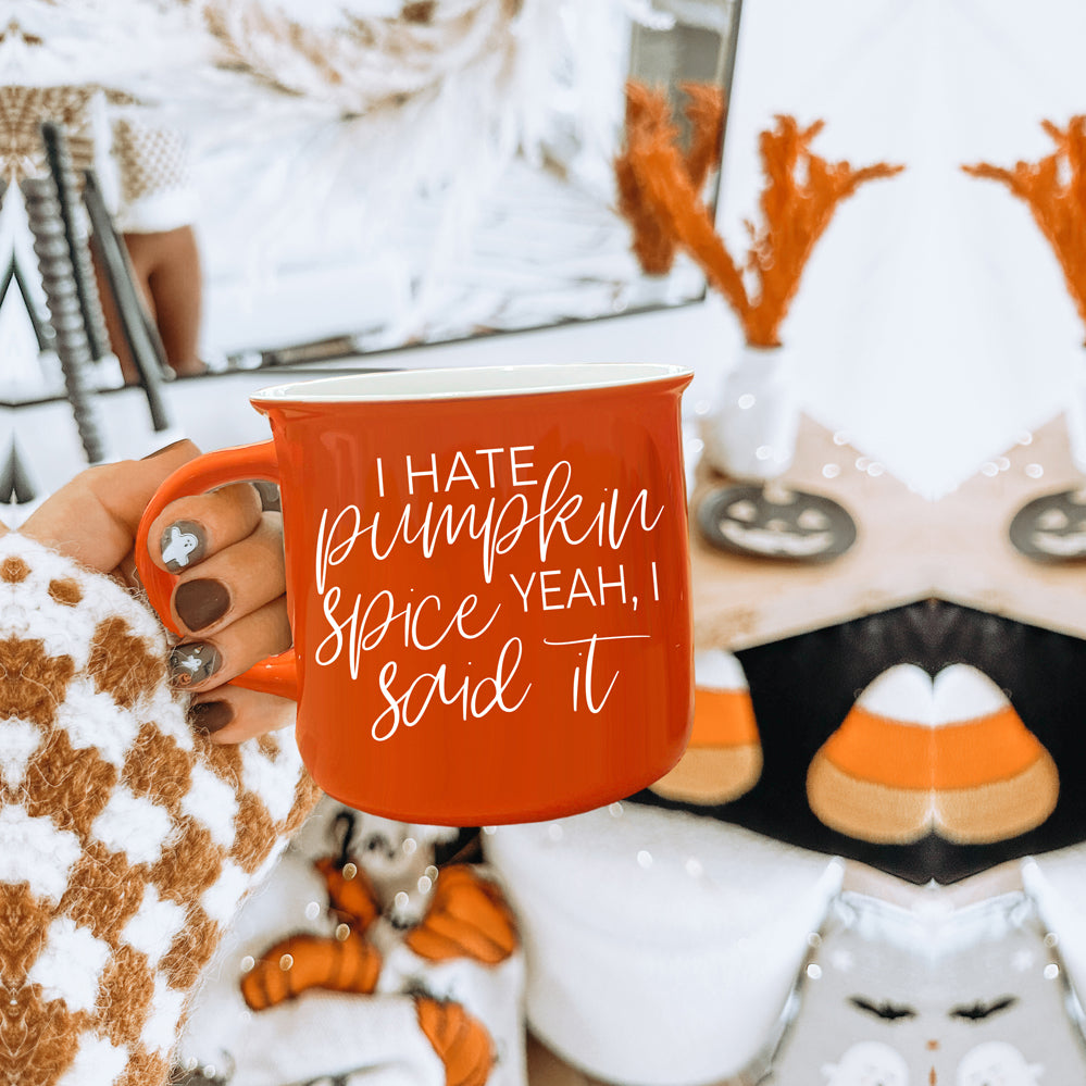 Hate Pumpkin Mug in vibrant orange with white lettering, featuring the phrase 'I hate pumpkin spice, yeah I said it' on both sides.