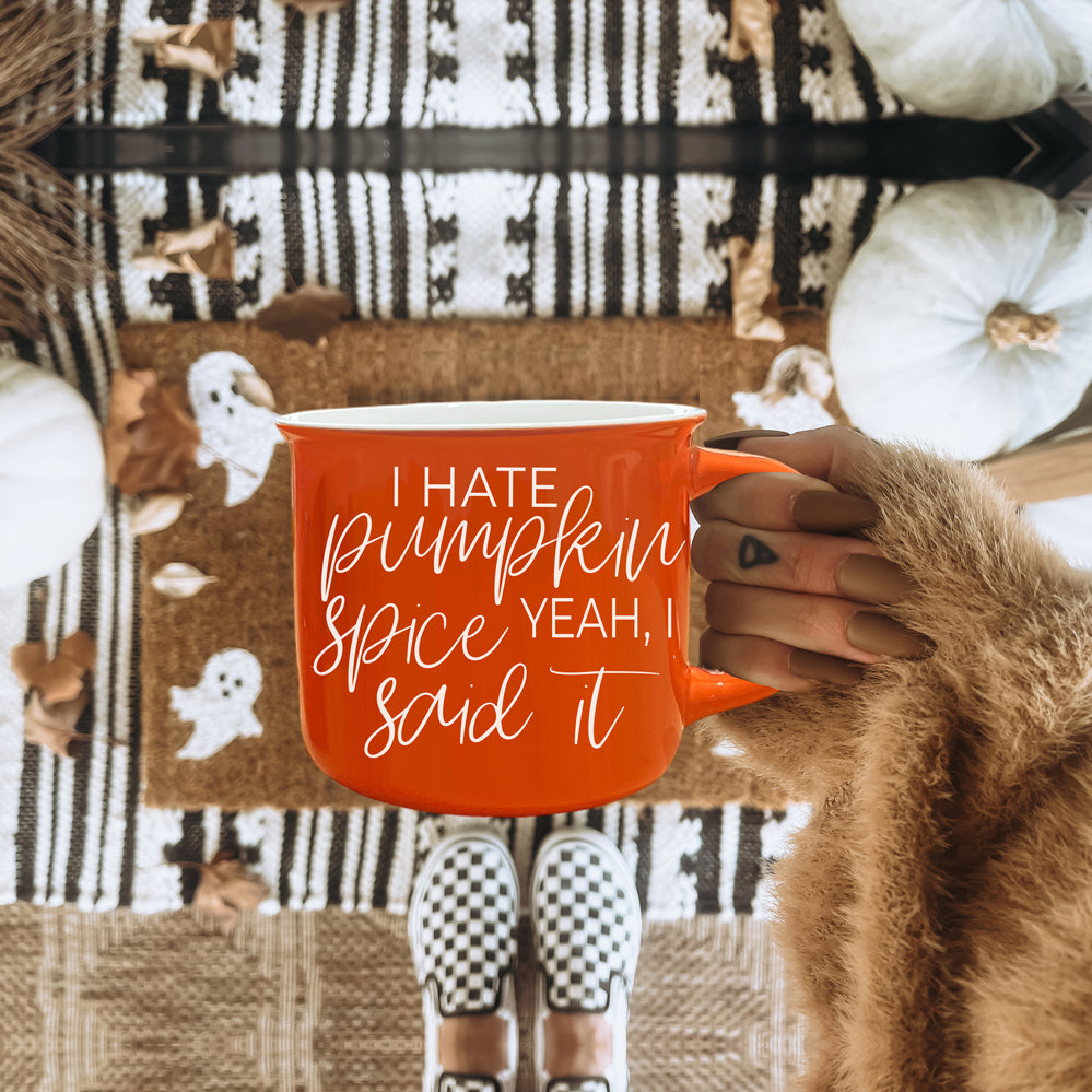 Hate Pumpkin Mug in vibrant orange with white lettering, featuring the phrase 'I hate pumpkin spice, yeah I said it' on both sides.