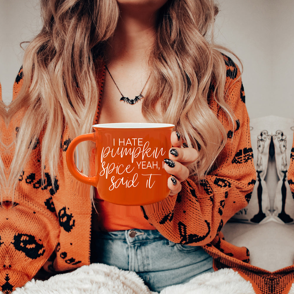 Hate Pumpkin Mug in vibrant orange with white lettering, featuring the phrase 'I hate pumpkin spice, yeah I said it' on both sides.