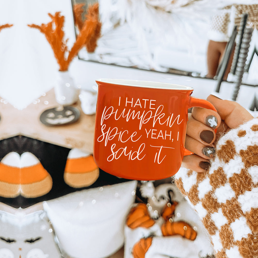 Hate Pumpkin Mug in vibrant orange with white lettering, featuring the phrase 'I hate pumpkin spice, yeah I said it' on both sides.