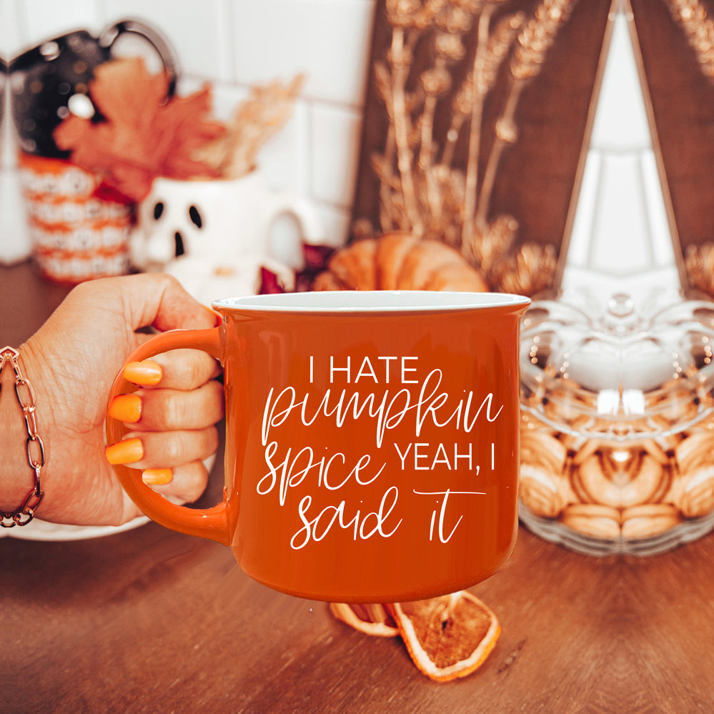 Hate Pumpkin Mug in vibrant orange with white lettering, featuring the phrase 'I hate pumpkin spice, yeah I said it' on both sides.