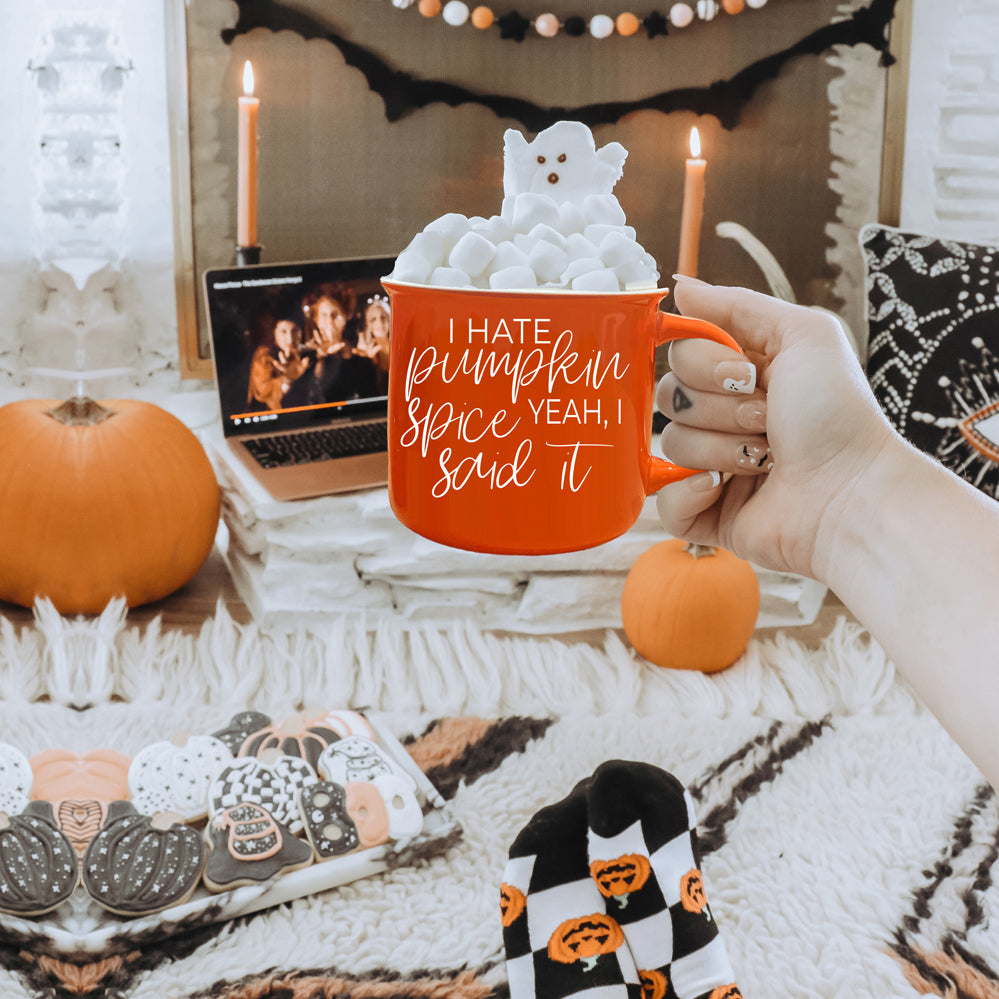 Hate Pumpkin Mug in vibrant orange with white lettering, featuring the phrase 'I hate pumpkin spice, yeah I said it' on both sides.