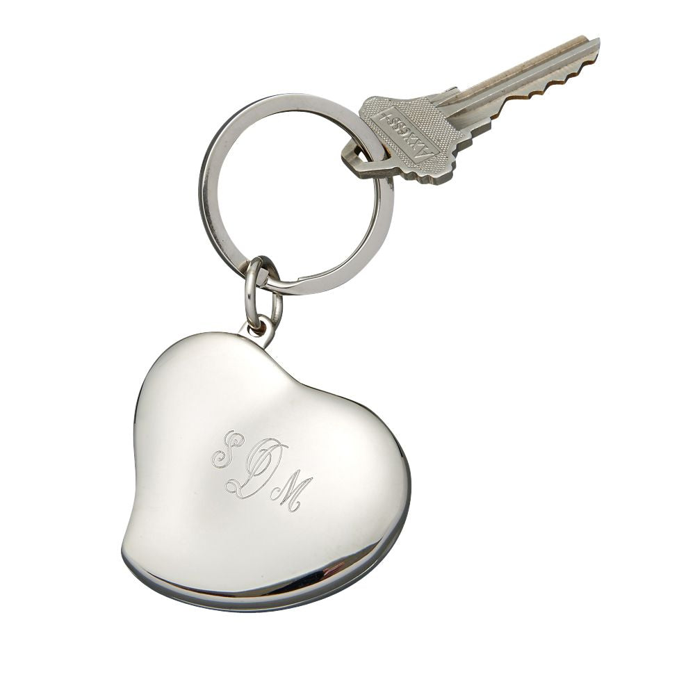 Heart shaped locket keychain with two photo slots and a shiny silver finish, elegantly designed for personal use or gifting.